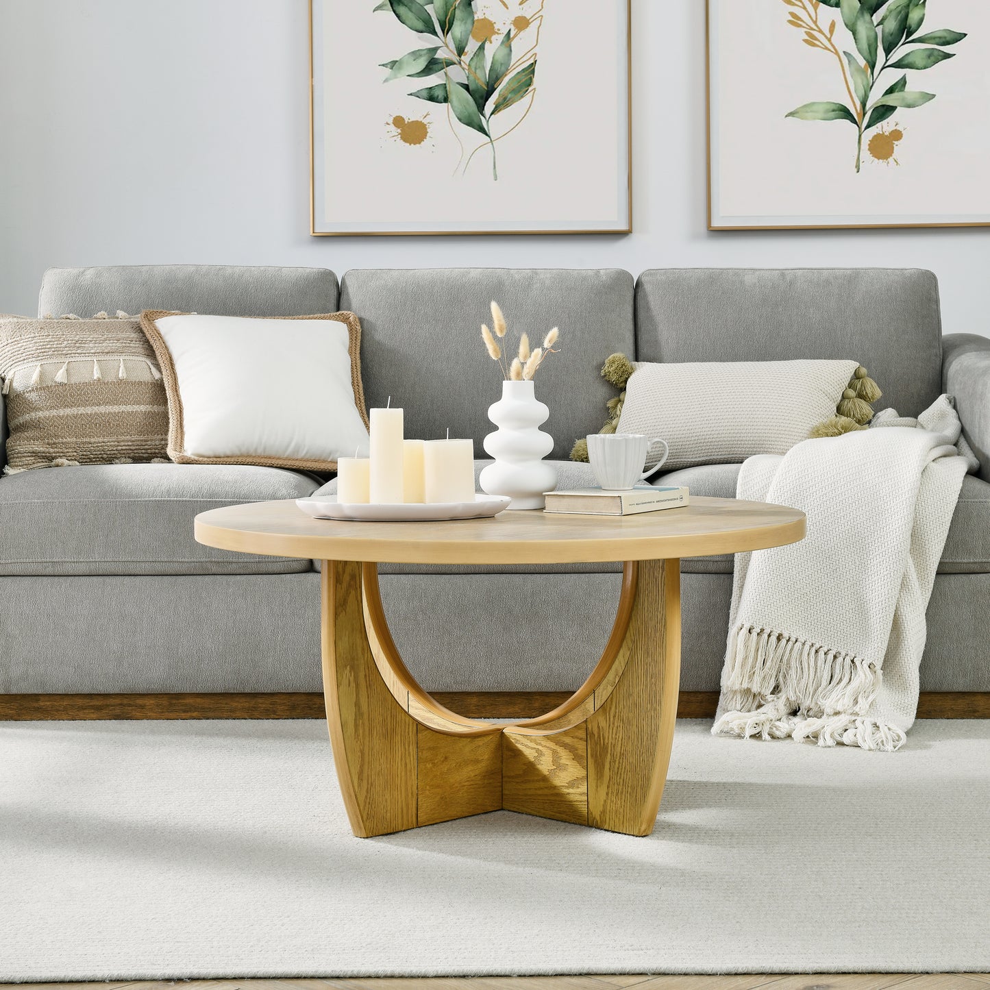 Round oak coffee table with curved wooden legs perfect for living rooms