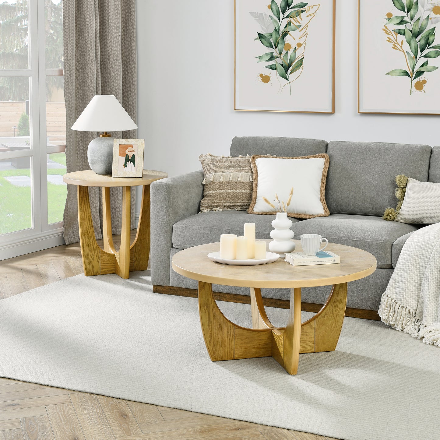 Round natural wood coffee table with curved base perfect for modern living rooms