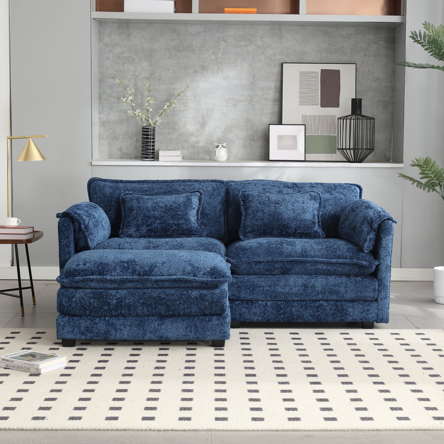 Plush navy blue sectional sofa with textured fabric and matching throw pillows