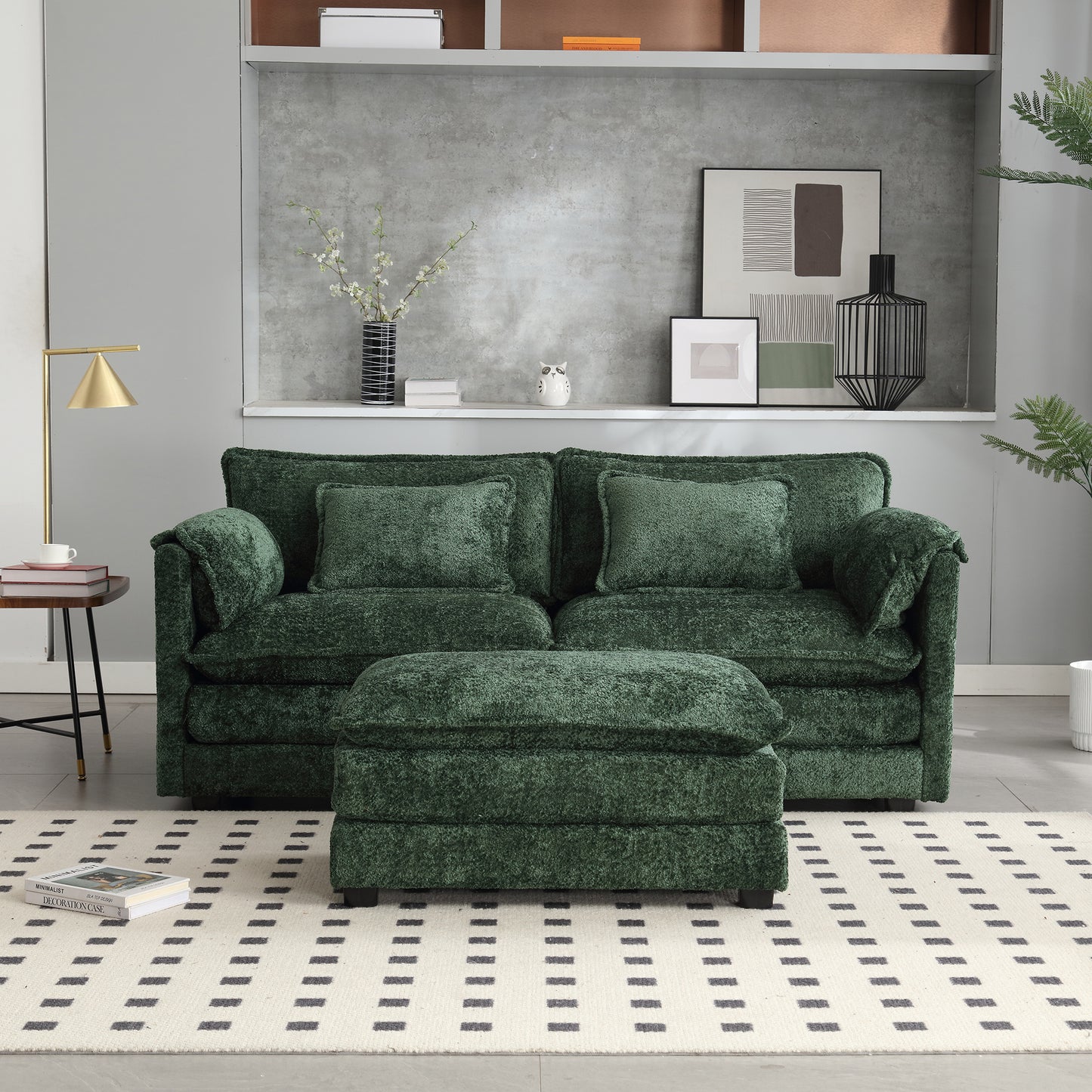 Plush emerald green velvet sofa with matching ottoman and accent pillows
