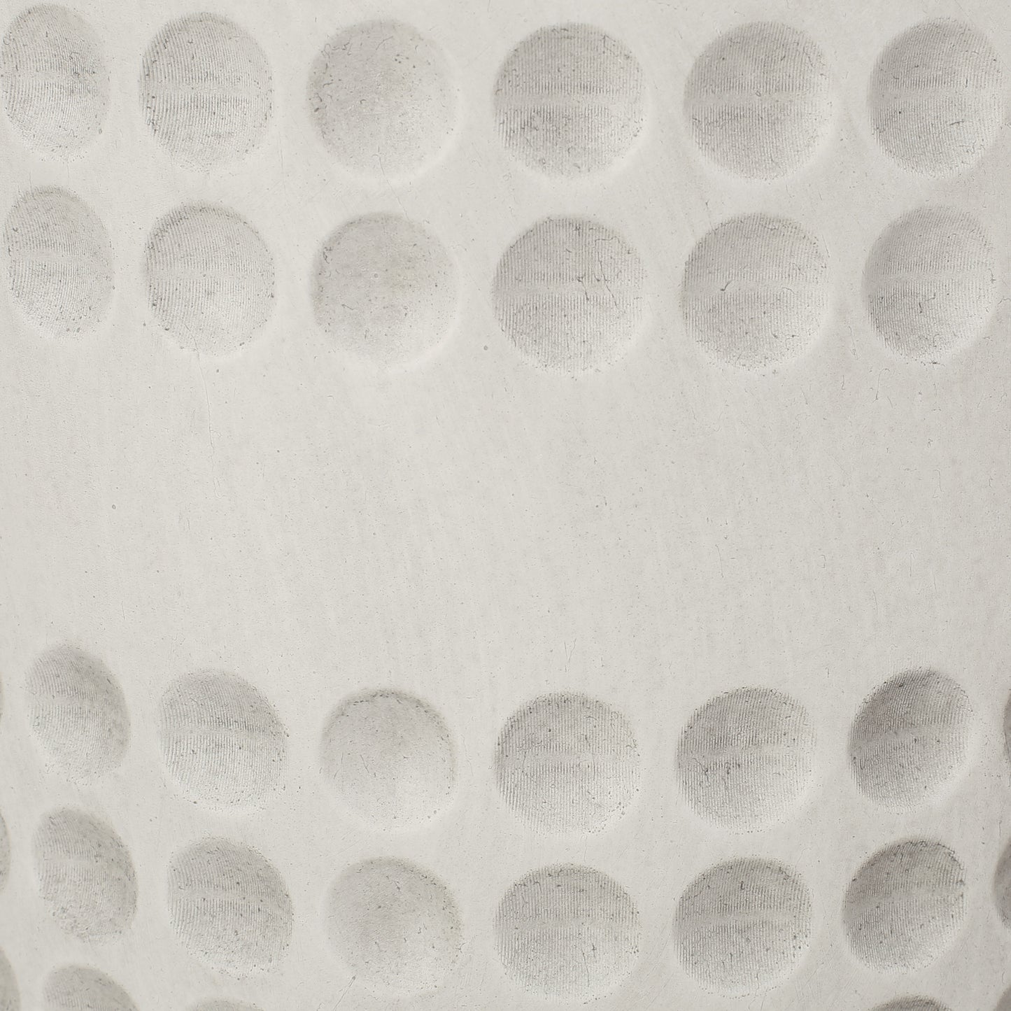 Closeup textured ceramic surface with embossed circular patterns