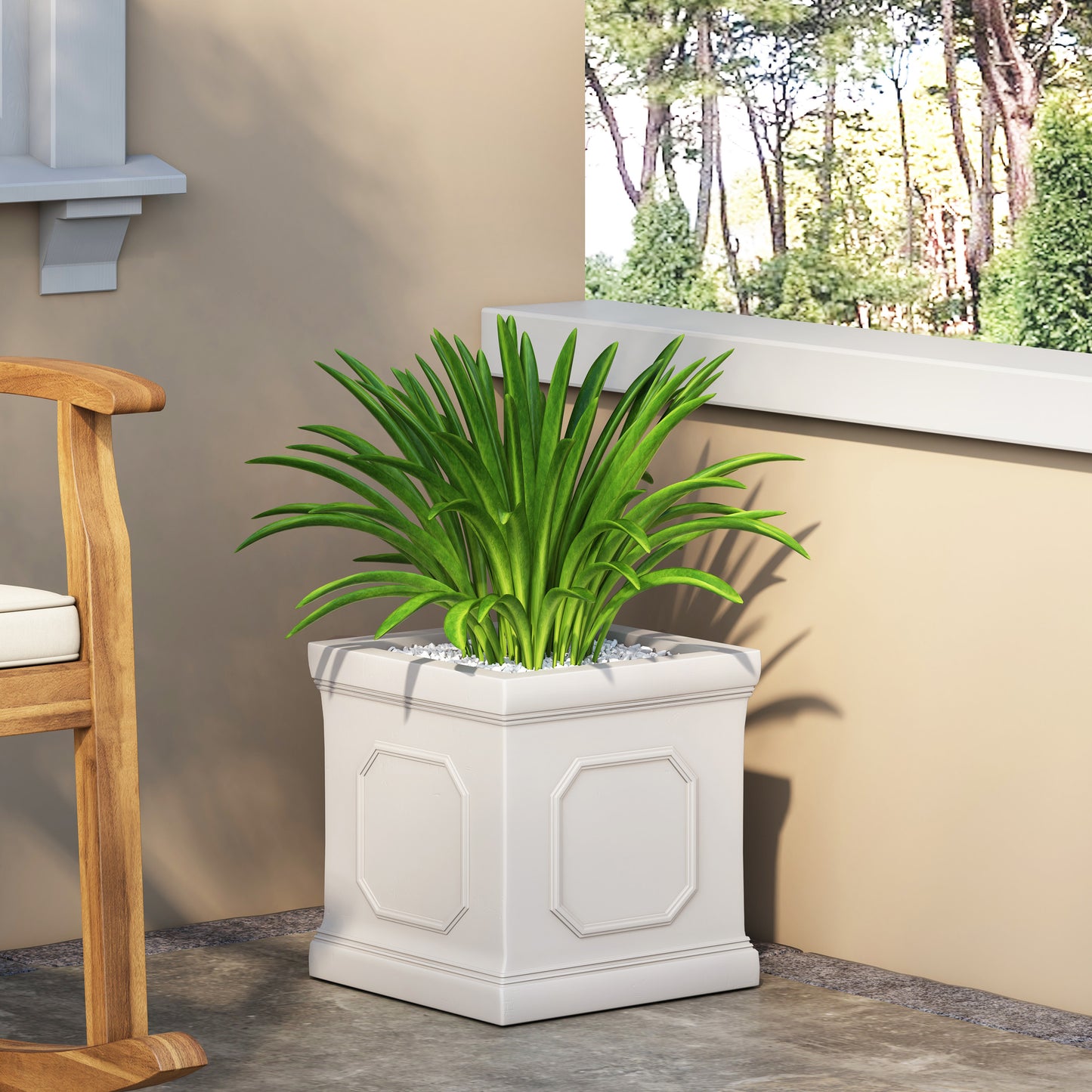 Tall white decorative planter with ornate detailing and lush green foliage