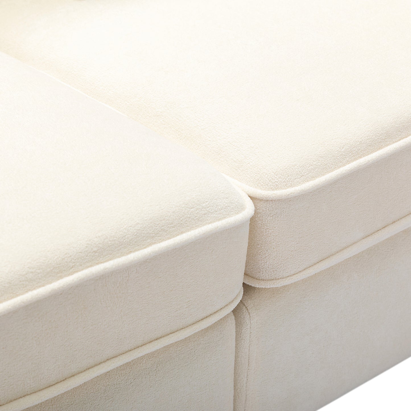 Cream boucle fabric sofa cushions with white piping detail