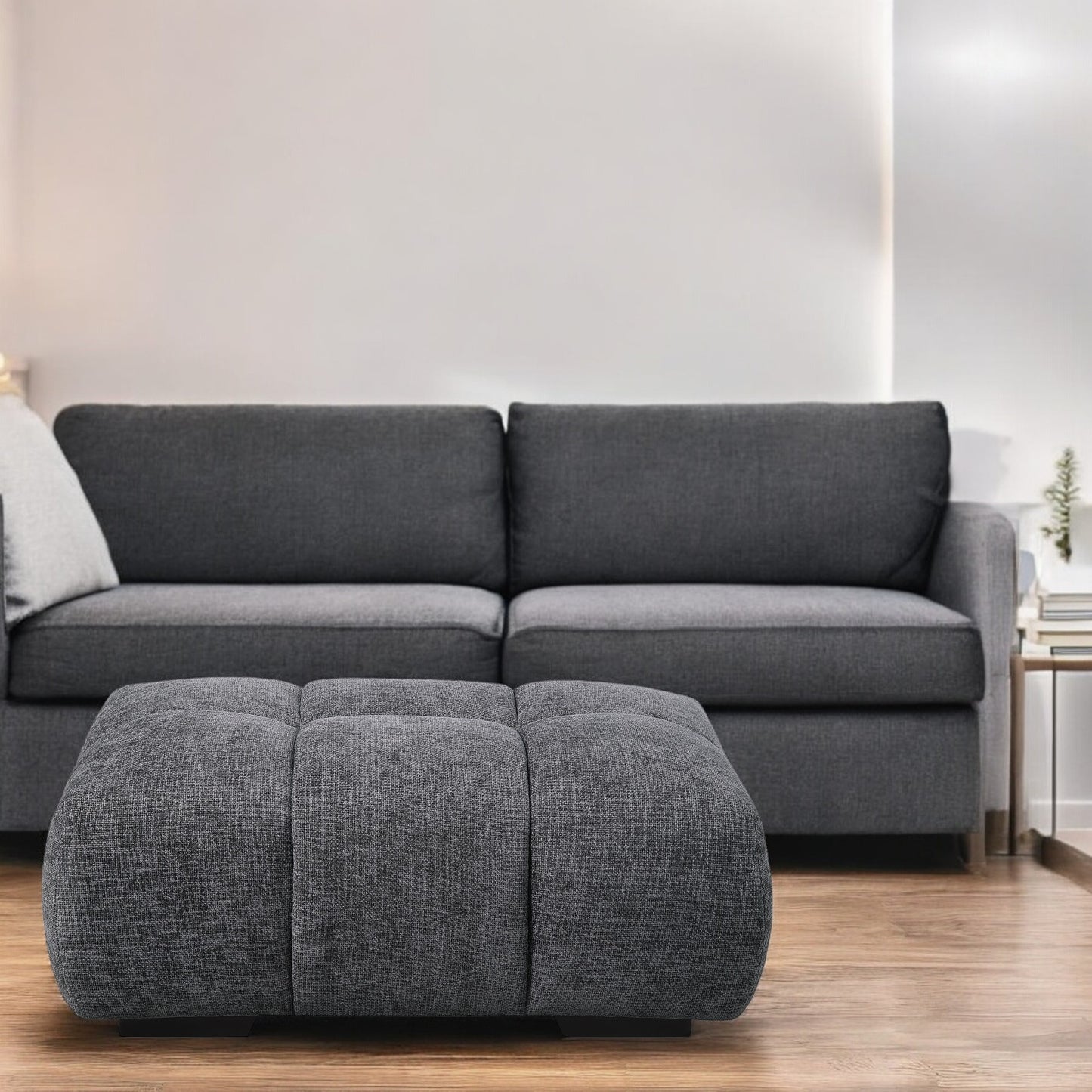 Tufted dark grey fabric ottoman with modern design perfect for living rooms