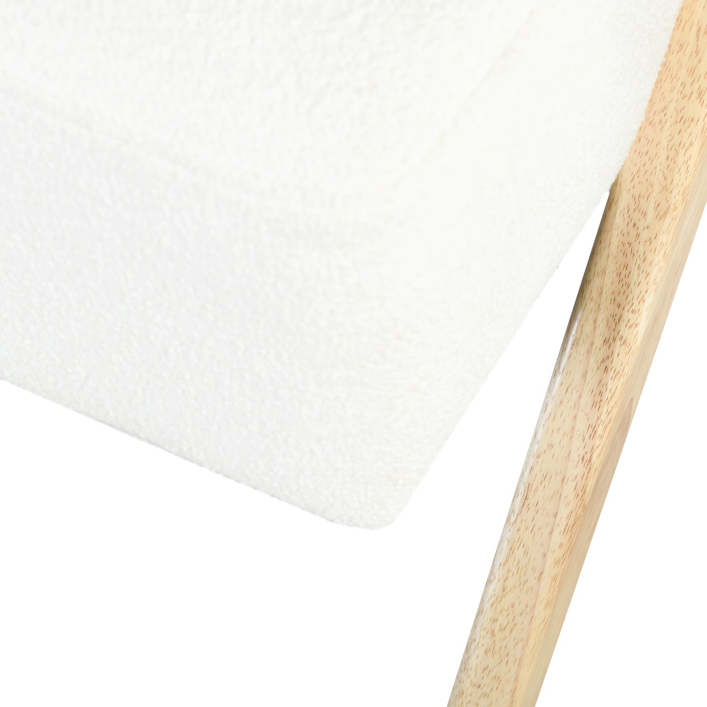 Closeup of a textured white fabric seat on a light wood frame chair