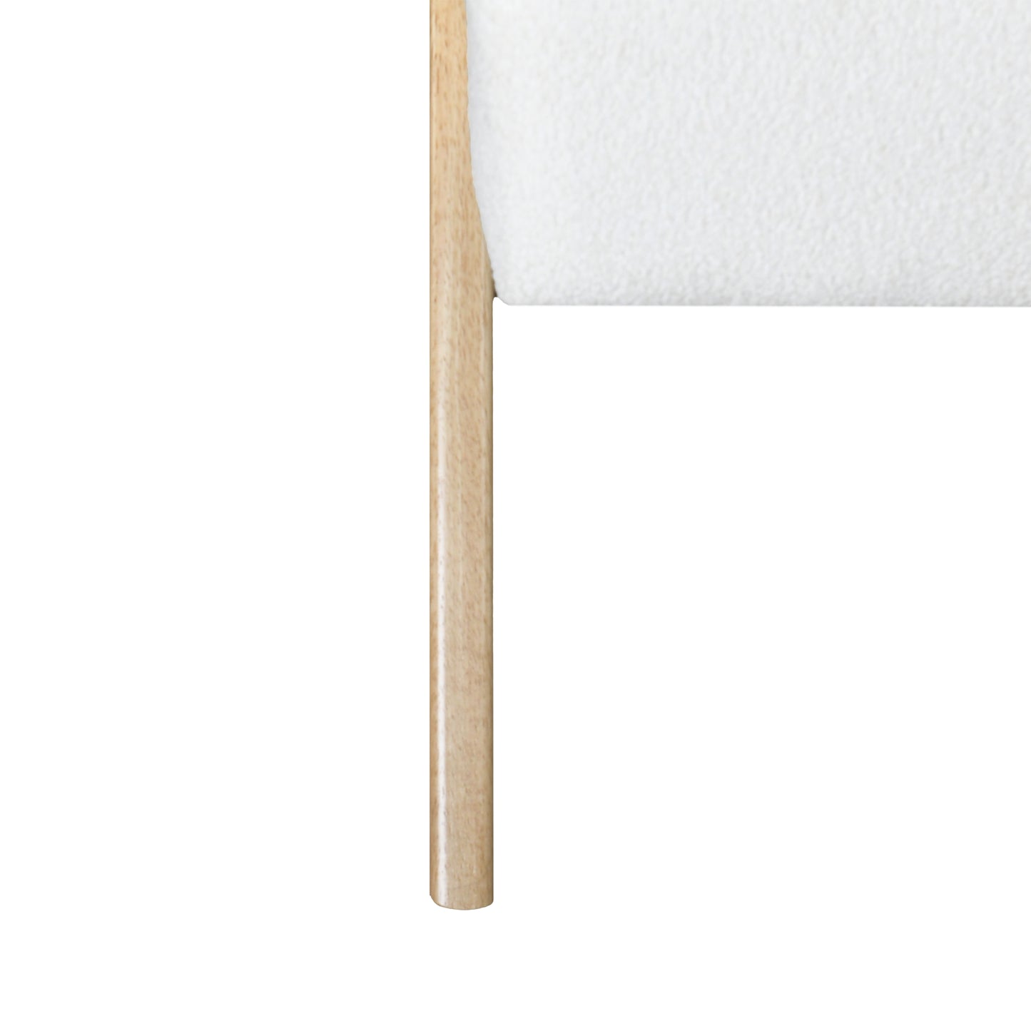 Close up of a minimalist wooden chair leg with a white textured seat