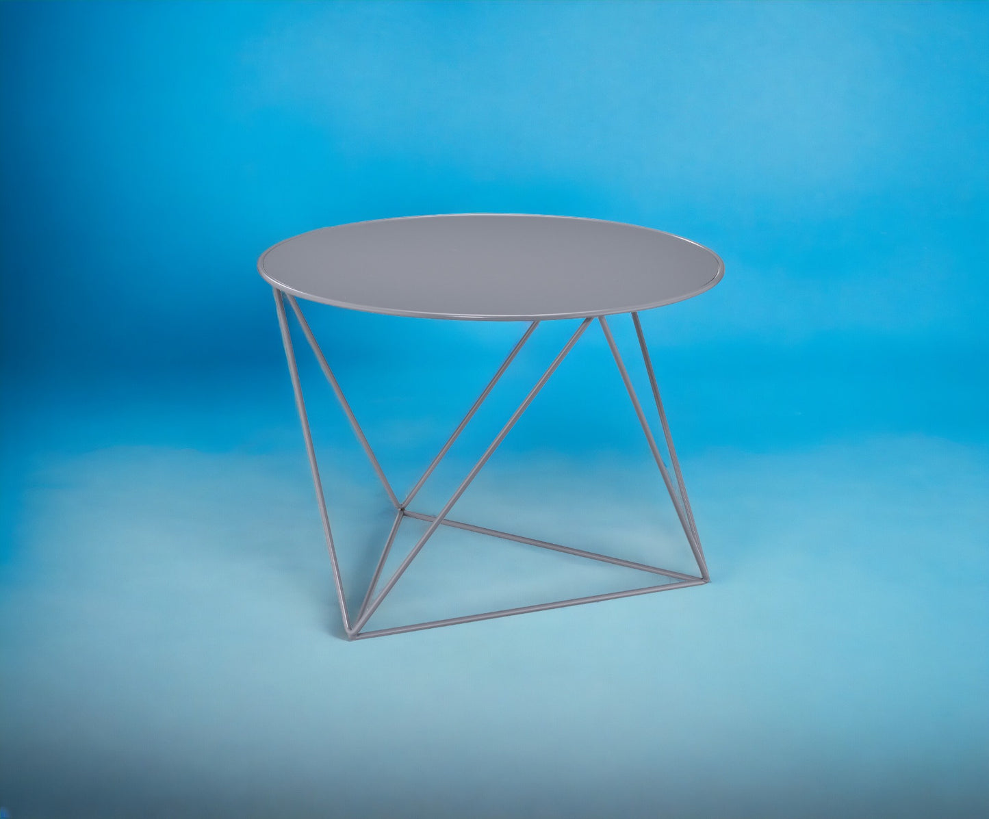Modern grey round side table with a minimalist geometric metal frame