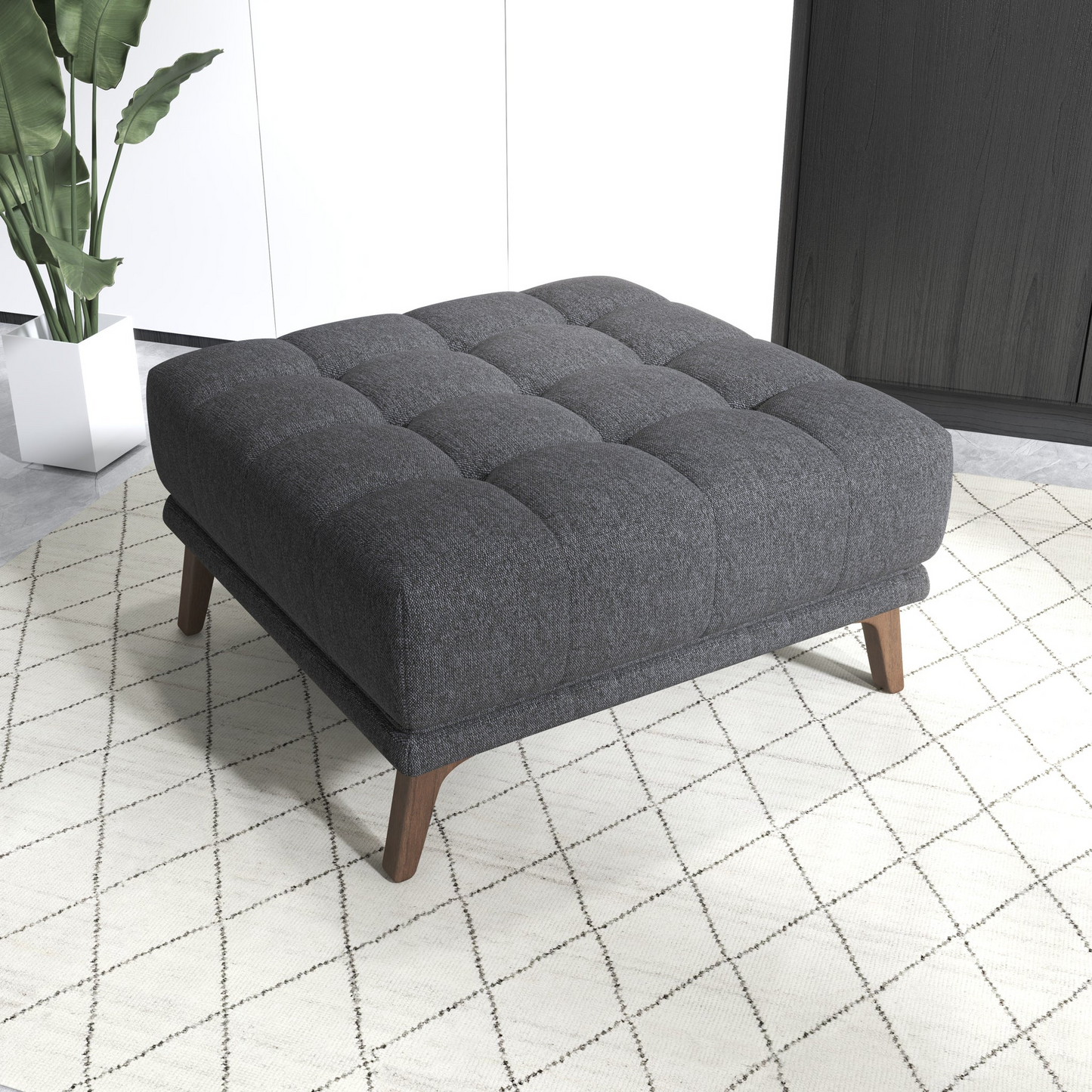 Dark gray tufted ottoman with wooden legs ideal for living room seating