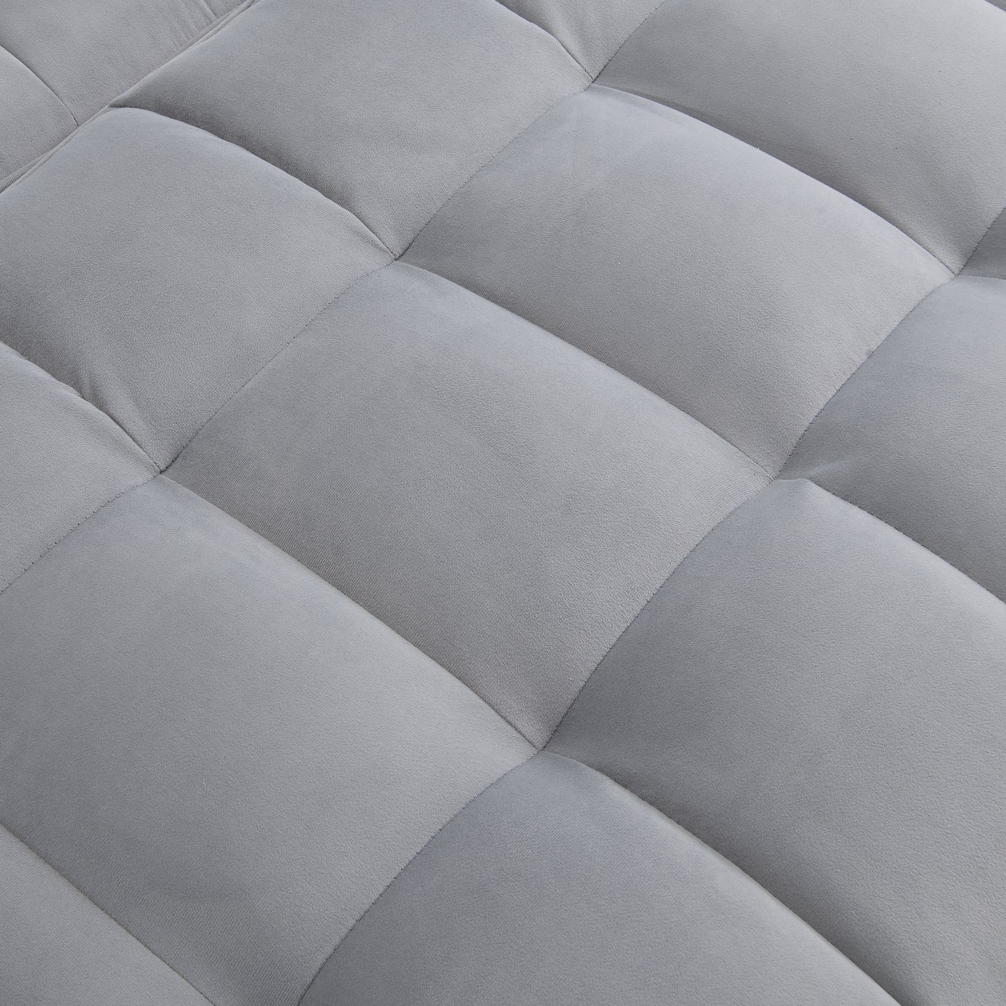 Closeup of plush grey fabric with diamond quilting ideal for upholstery projects