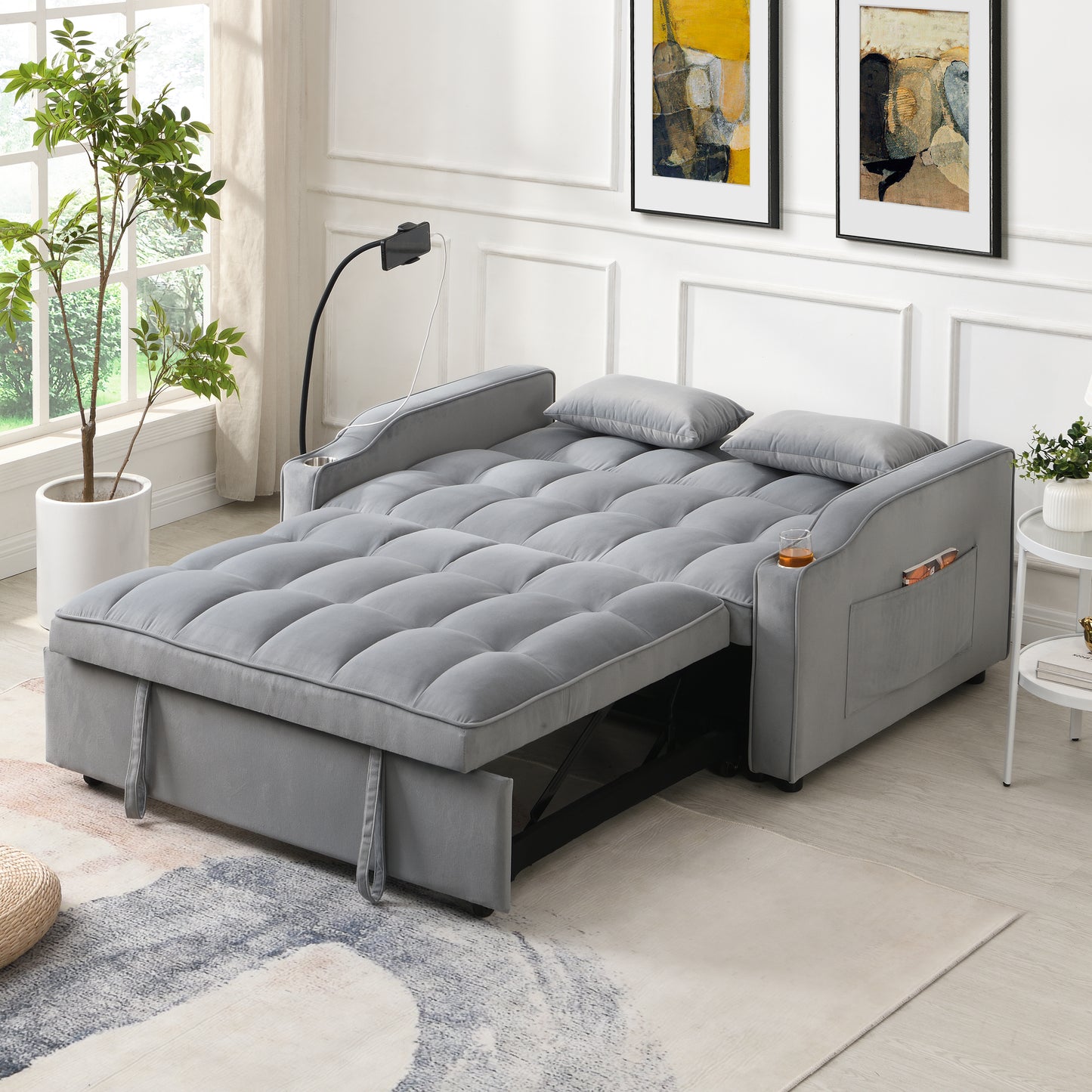 Grey velvet convertible sofa bed with tufted cushions and storage pockets
