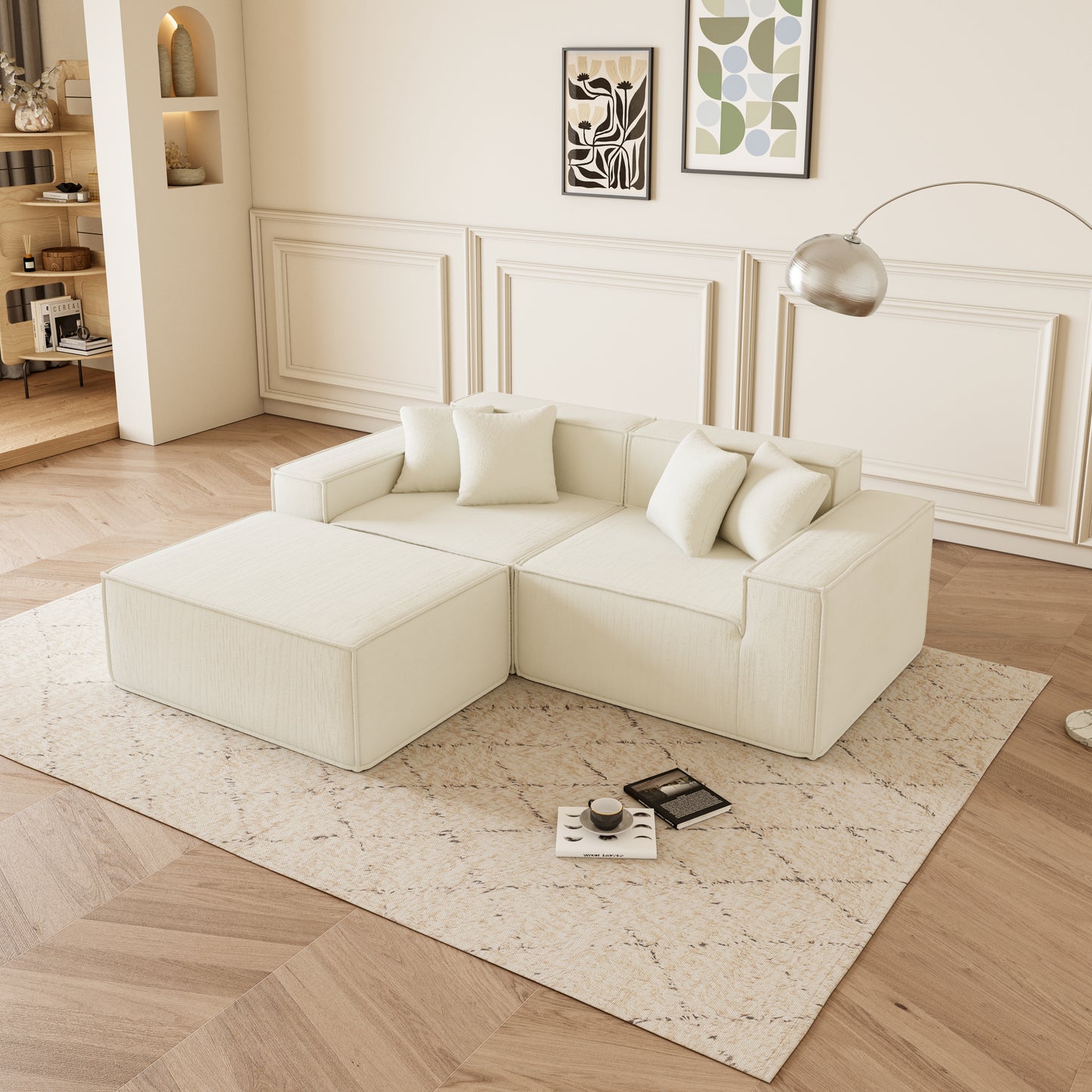 Cream linen modular sofa with plush cushions and matching ottoman on a patterned rug