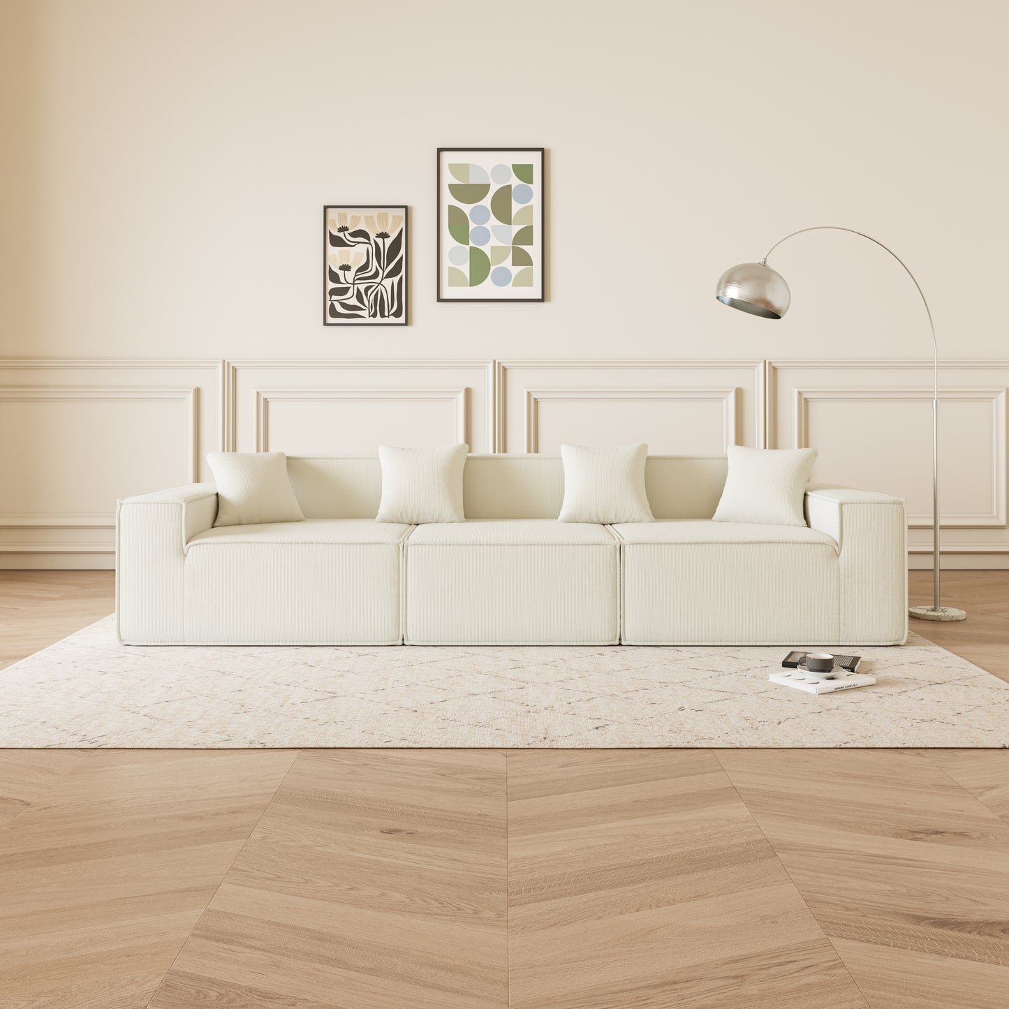 Modular cream corduroy sofa with plush pillows and minimalist art