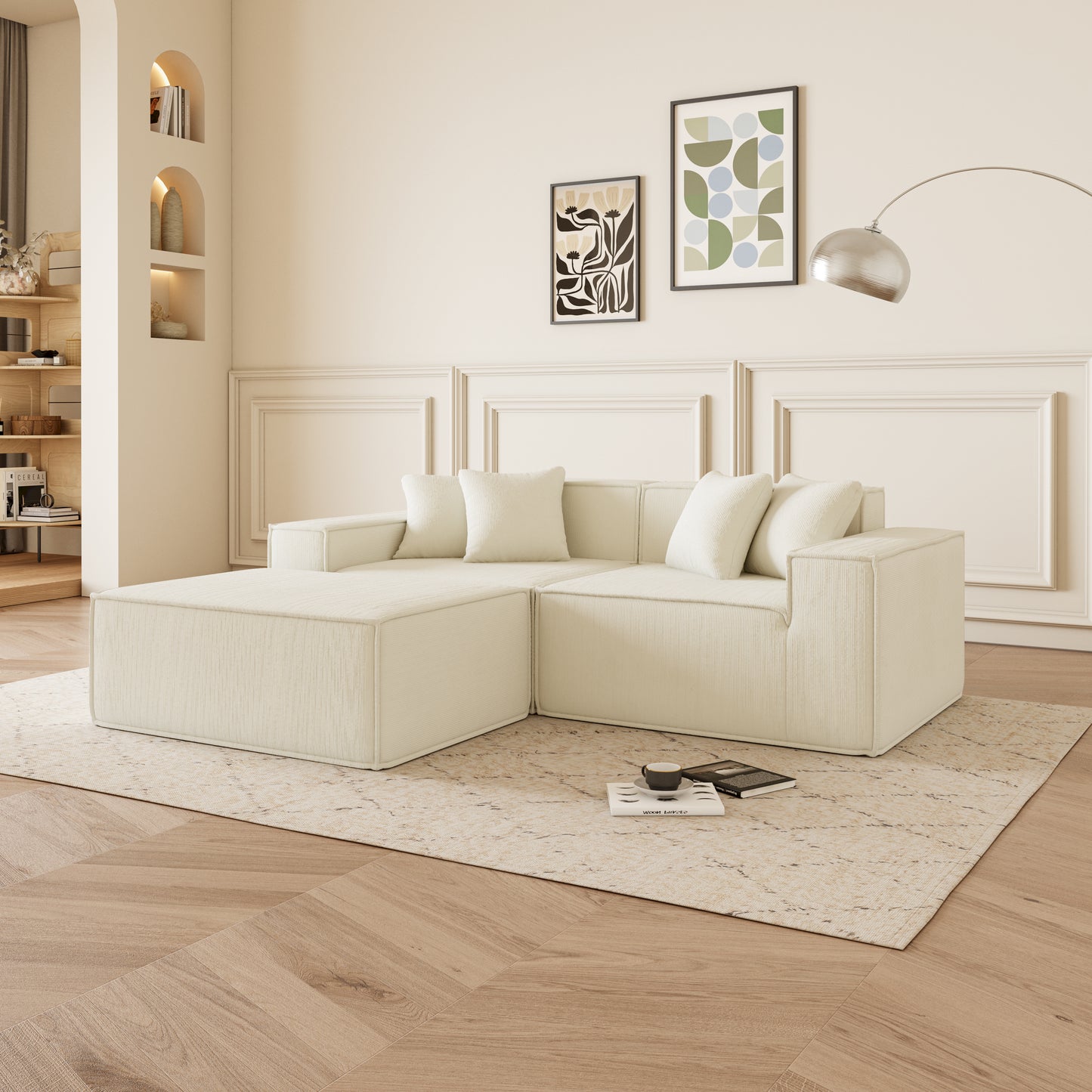 Cream modular sectional sofa with ottoman and plush cushions on a patterned rug