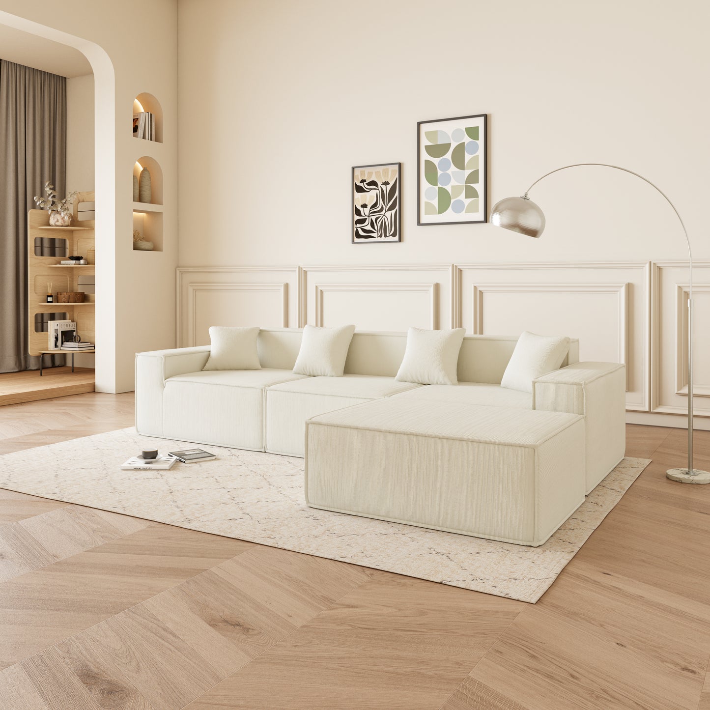 Cream sectional sofa with plush cushions and ottoman on a patterned rug