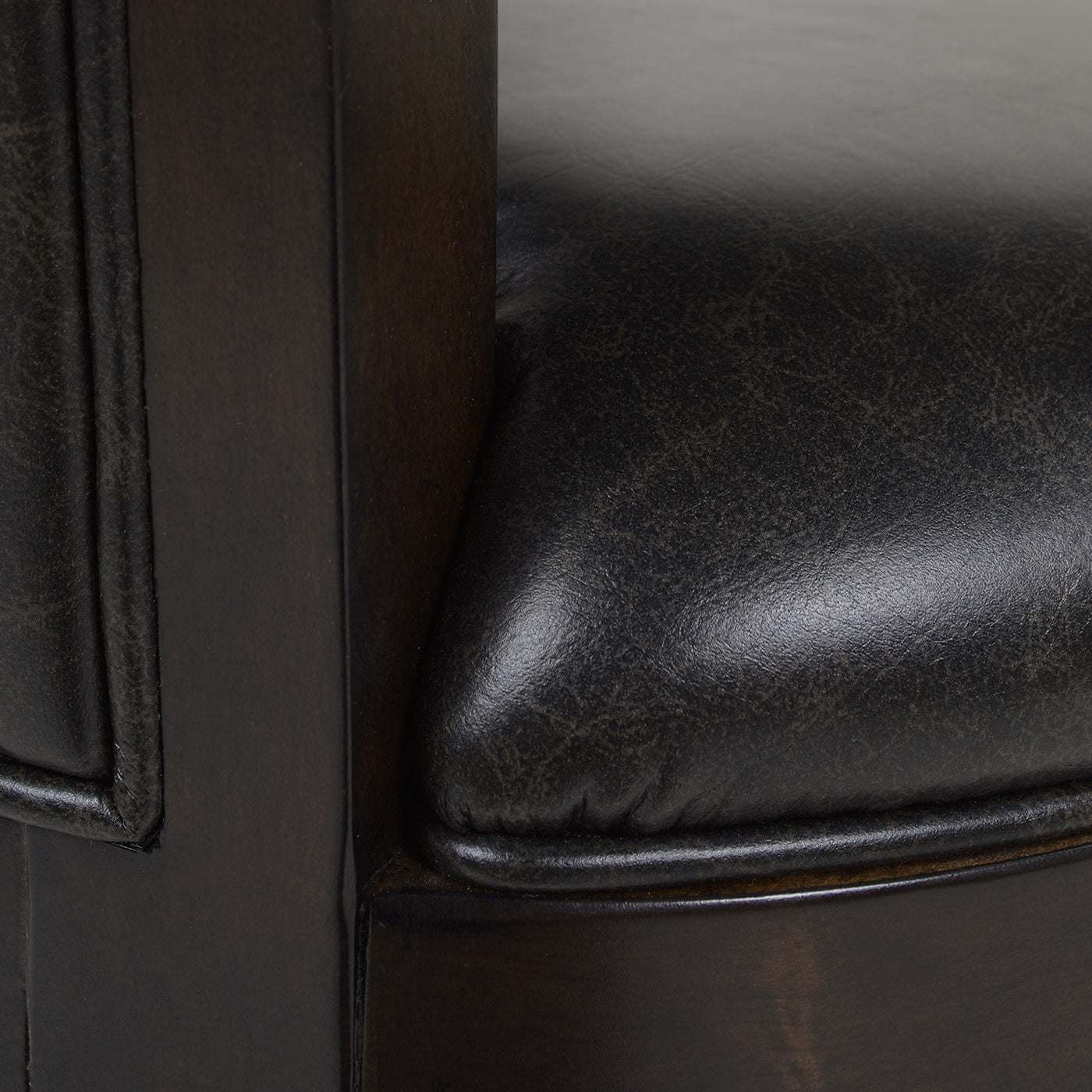 Dark brown leather accent chair seat with textured finish