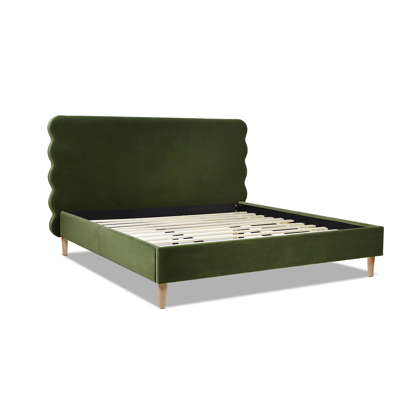Green velvet bed frame with scalloped headboard and wooden legs