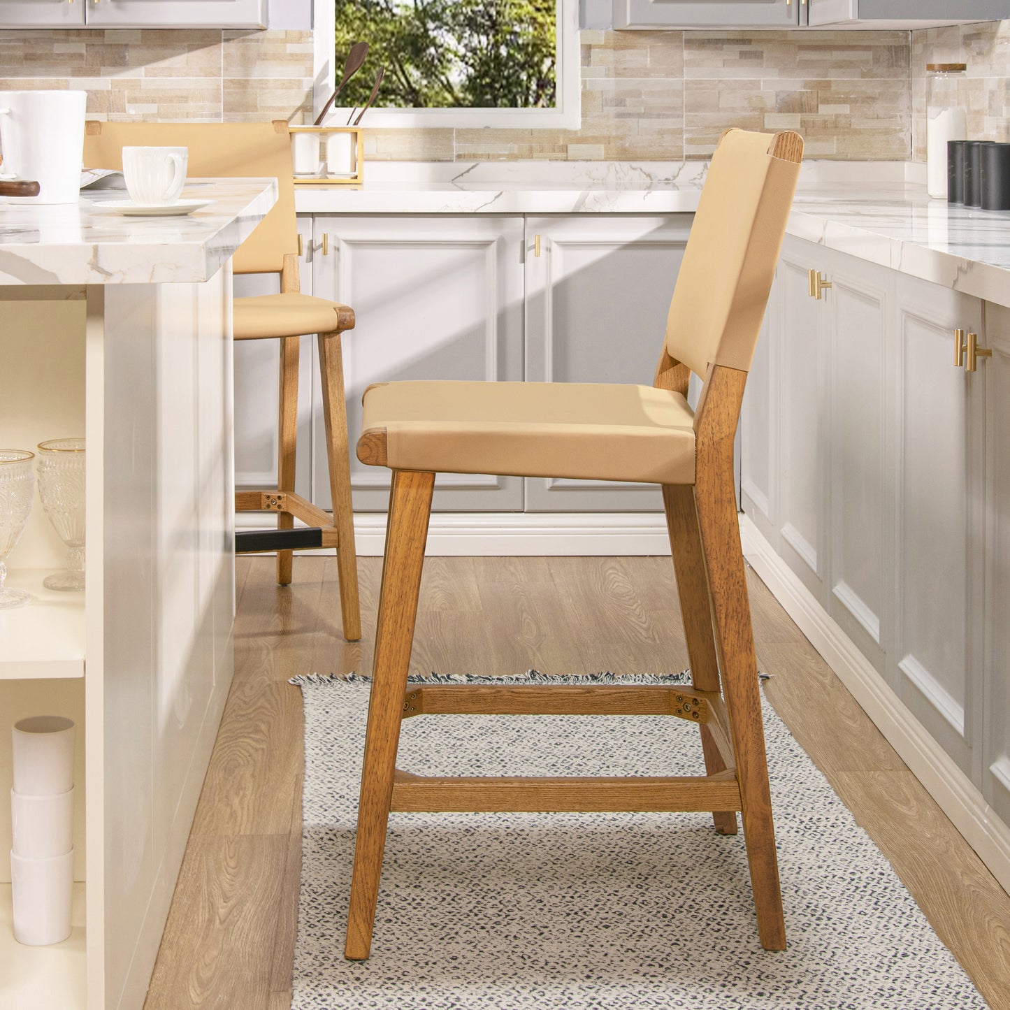 Tan leather and wood bar stool with a modern design perfect for kitchen islands