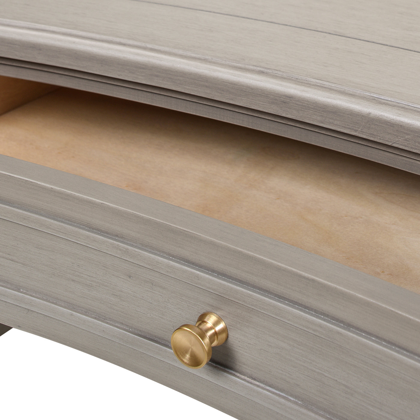 Gray wood dresser drawer with brass knob showcasing quality craftsmanship