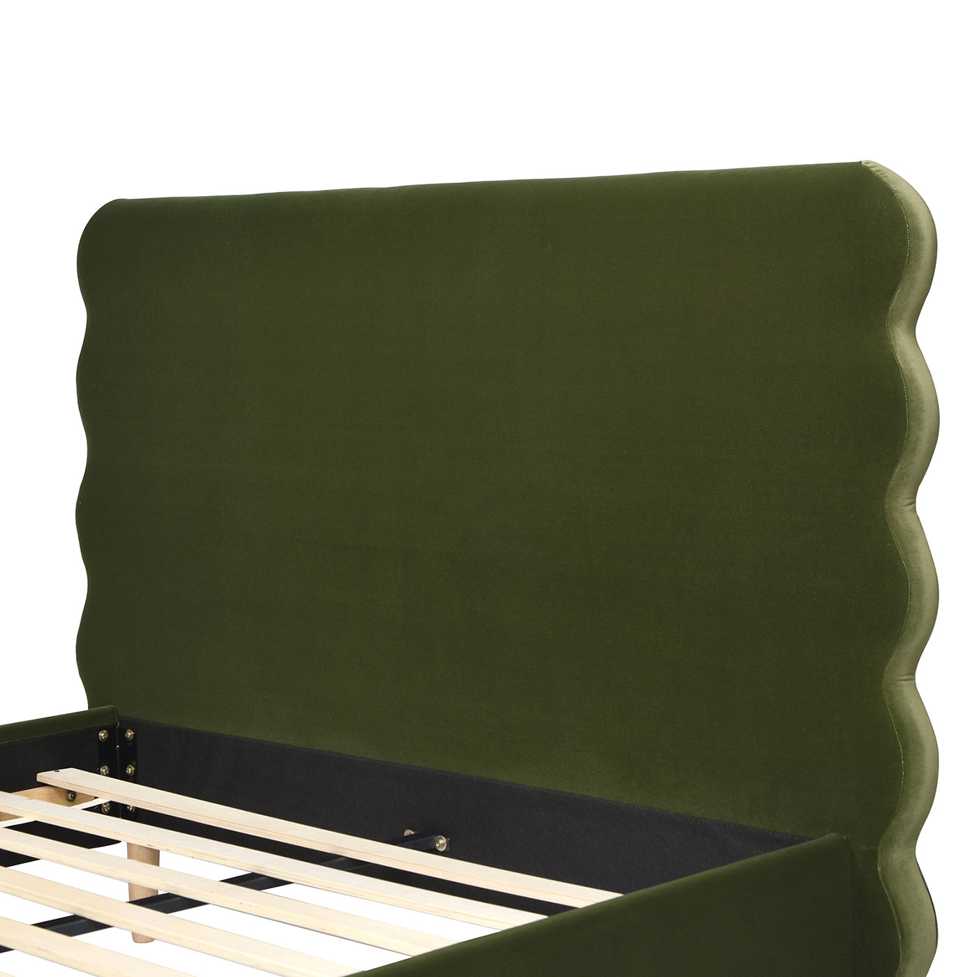 Green velvet bed frame with scalloped headboard detail showing wooden slats