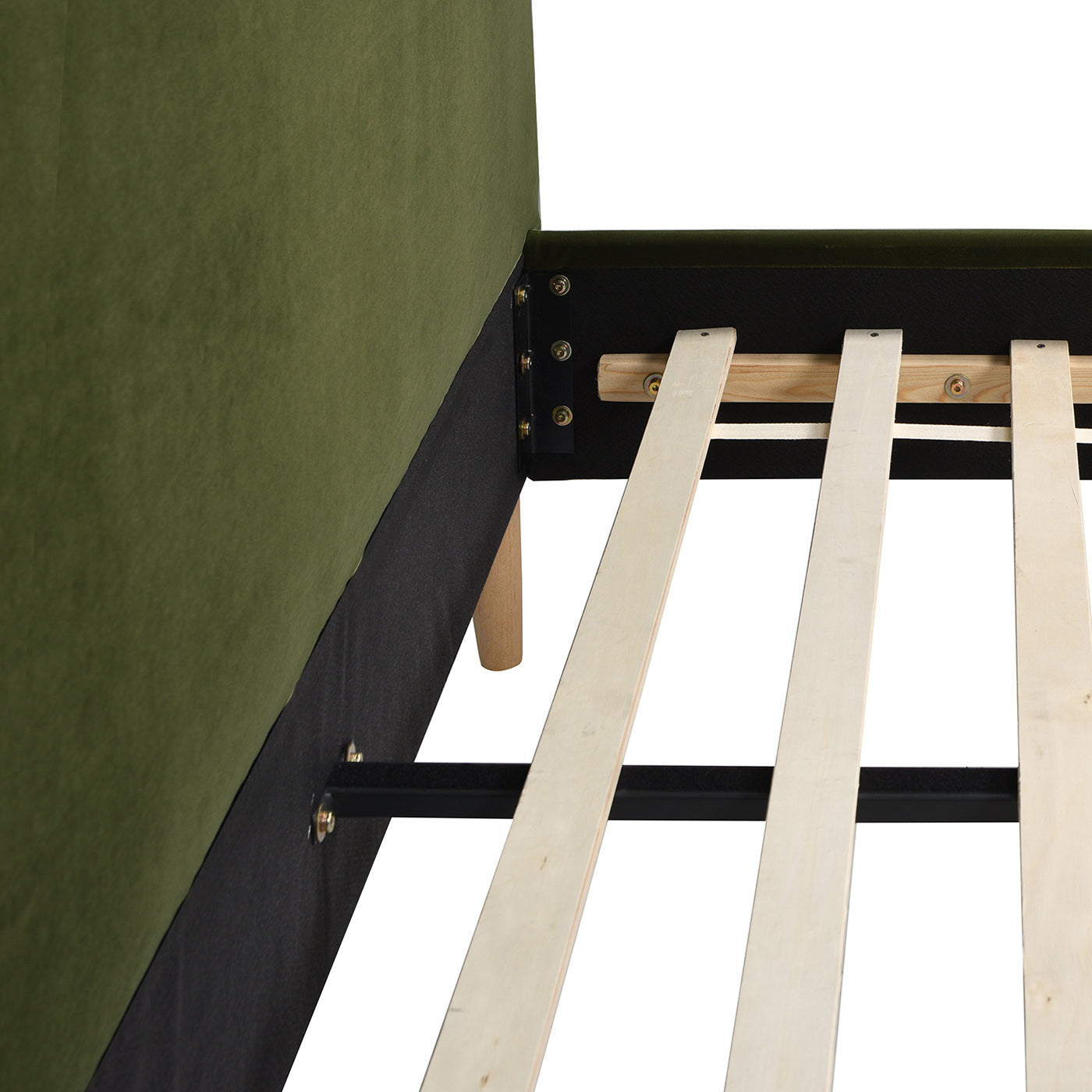 Closeup of green velvet upholstered bed frame with wooden slats and metal support