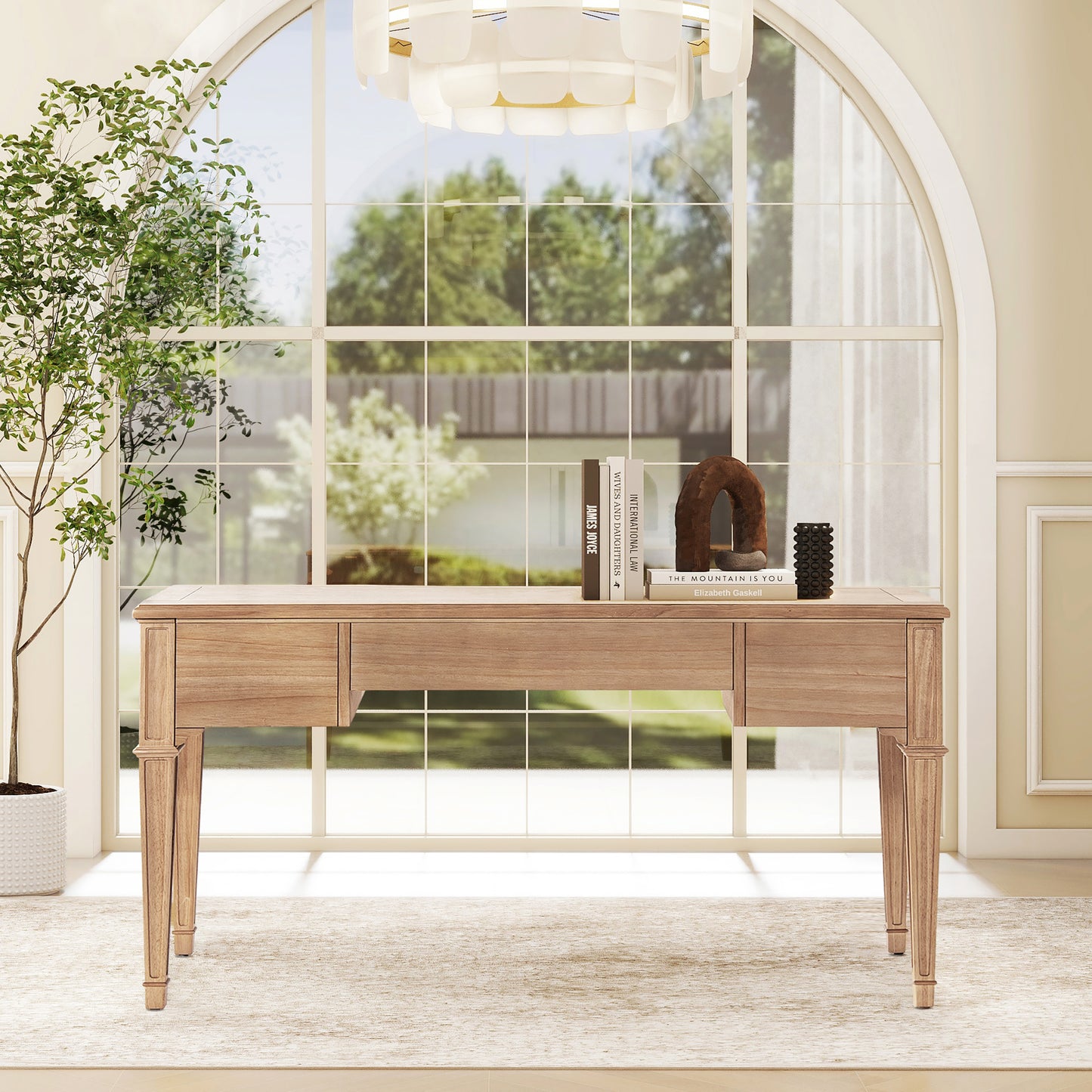 Elegant light wood desk with three drawers and carved legs ideal for a home office
