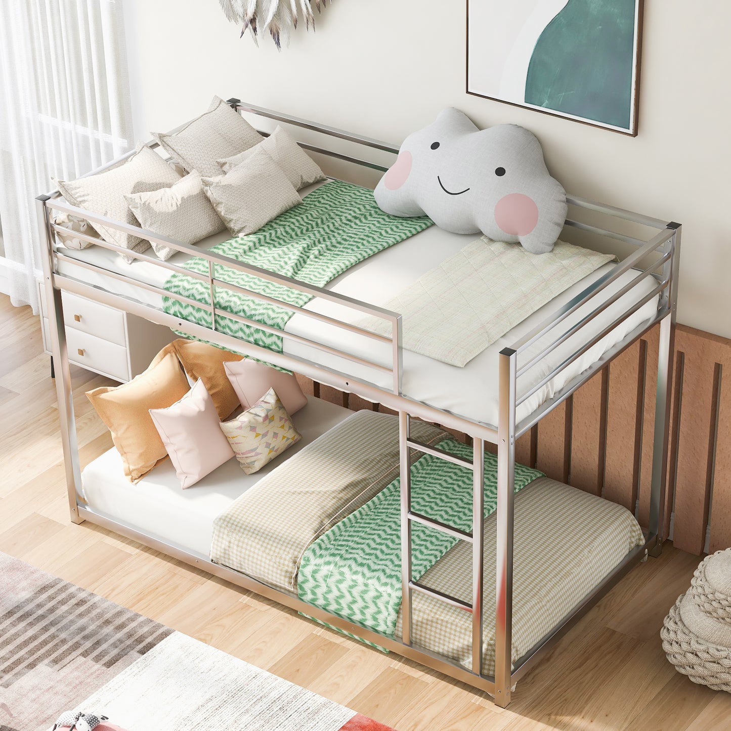 Sleek silver metal bunk bed with white mattresses green patterned blankets and decorative pillows