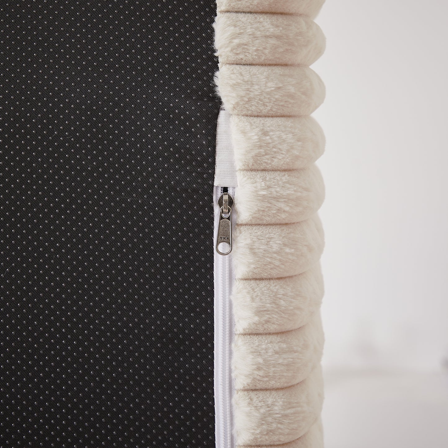 Cream plush dog bed cover with zippered closure and nonslip backing detail
