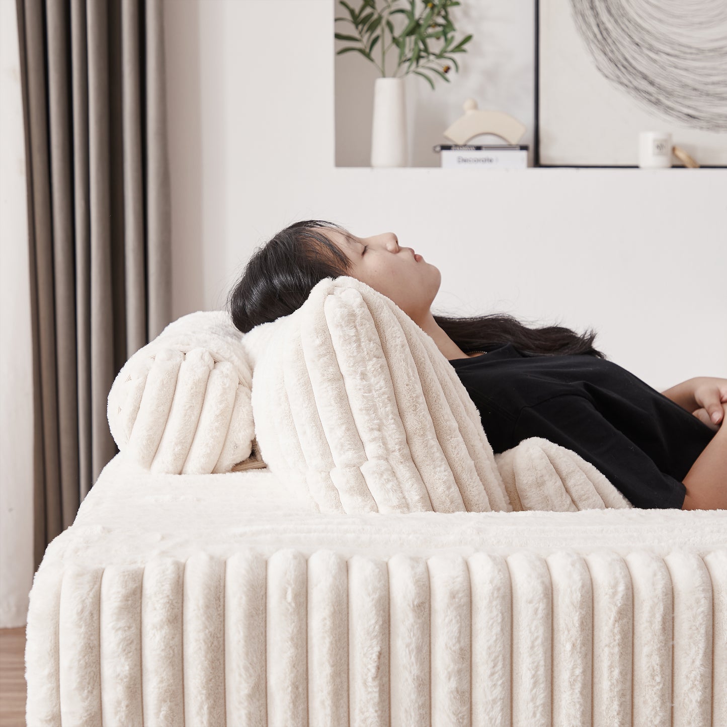 Plush ivory corduroy pillow for comfortable back support on a sofa