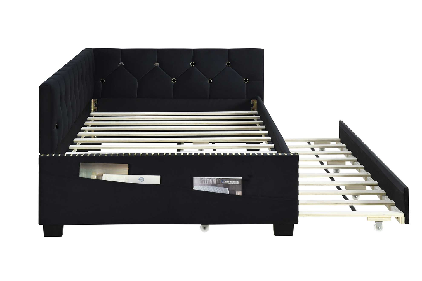 Black velvet tufted daybed with pullout trundle and storage pockets