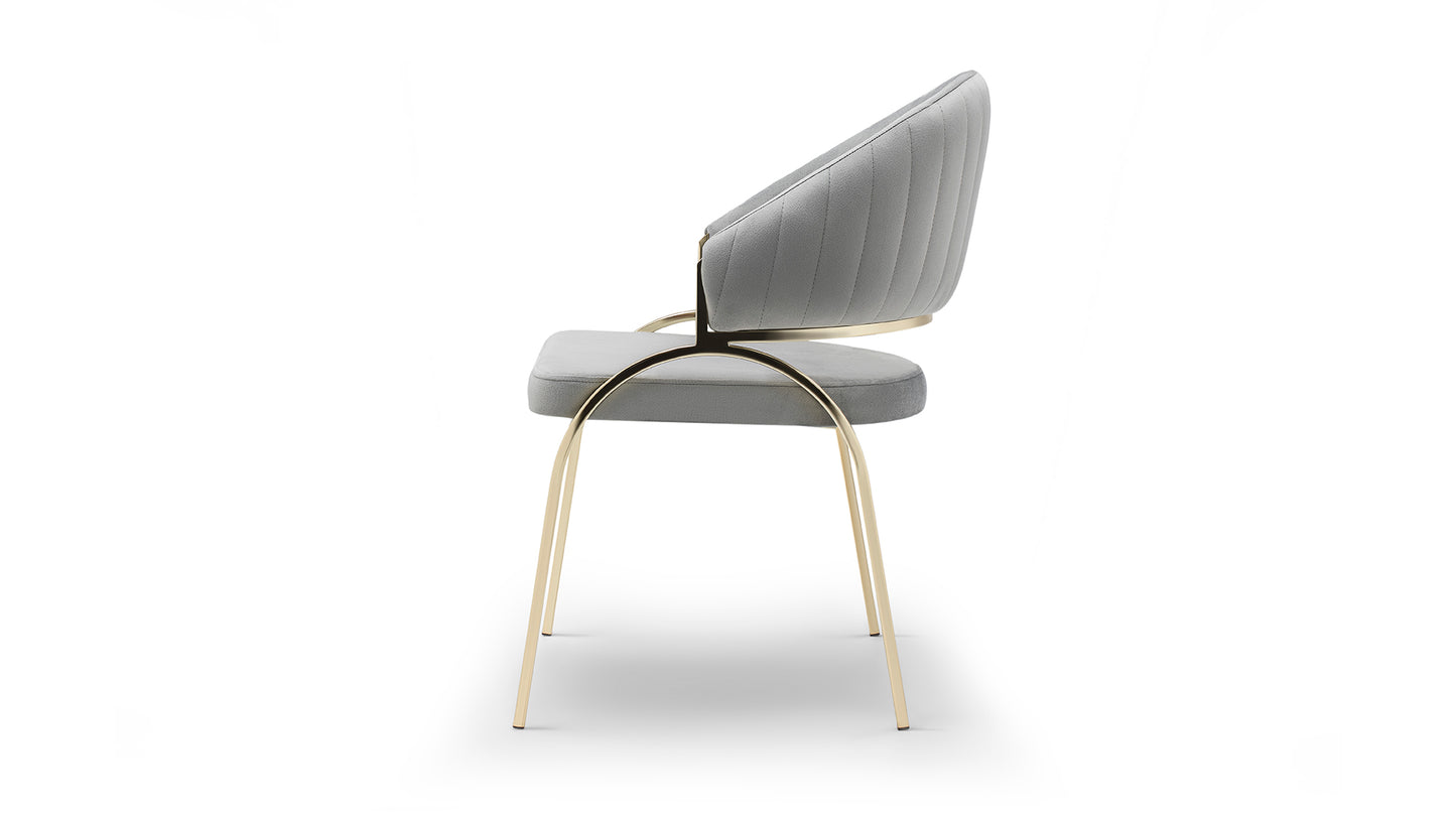 Modern grey velvet dining chair with elegant gold metal legs and subtle stitching detail