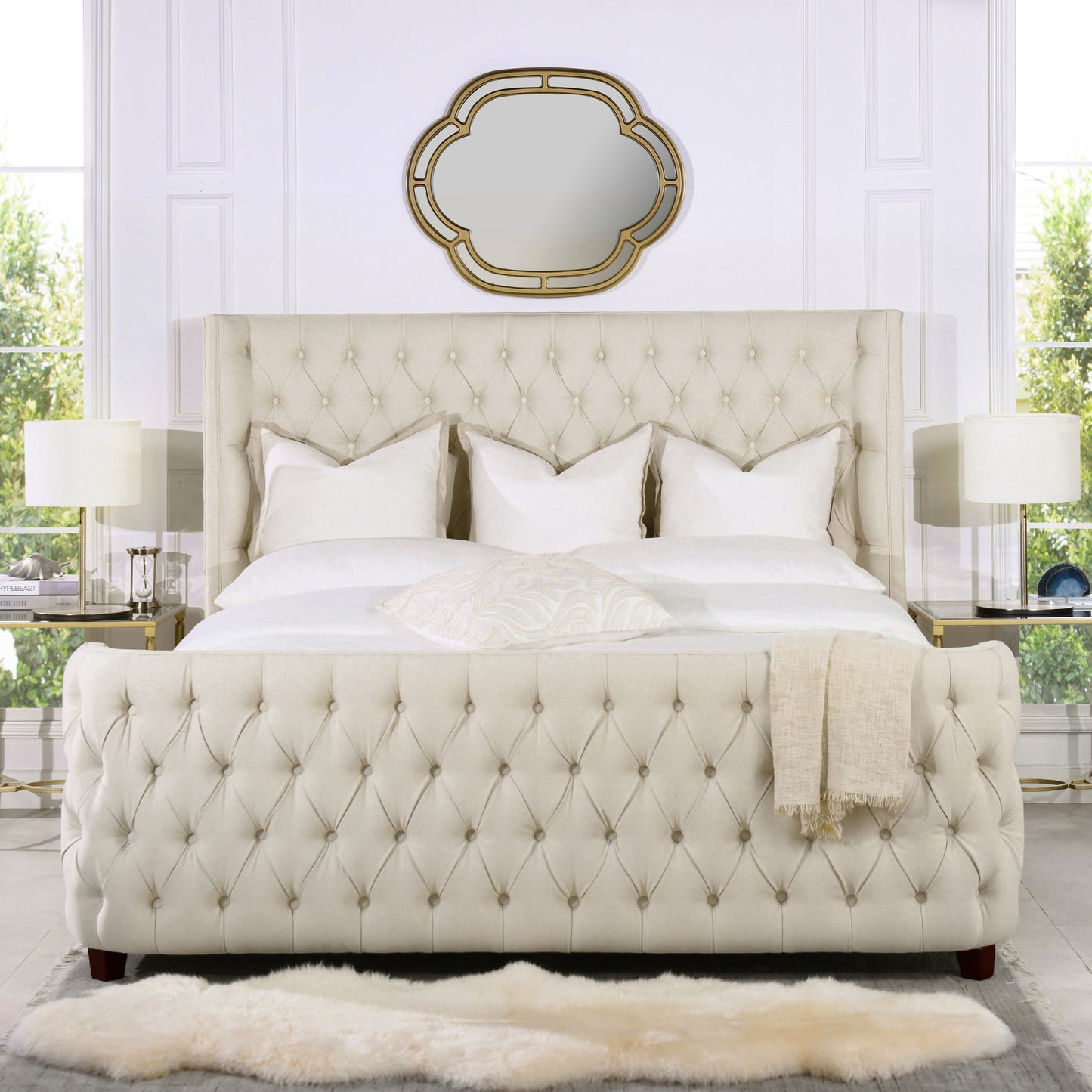 Tufted beige upholstered bed with diamond tufting crisp white bedding and decorative pillows