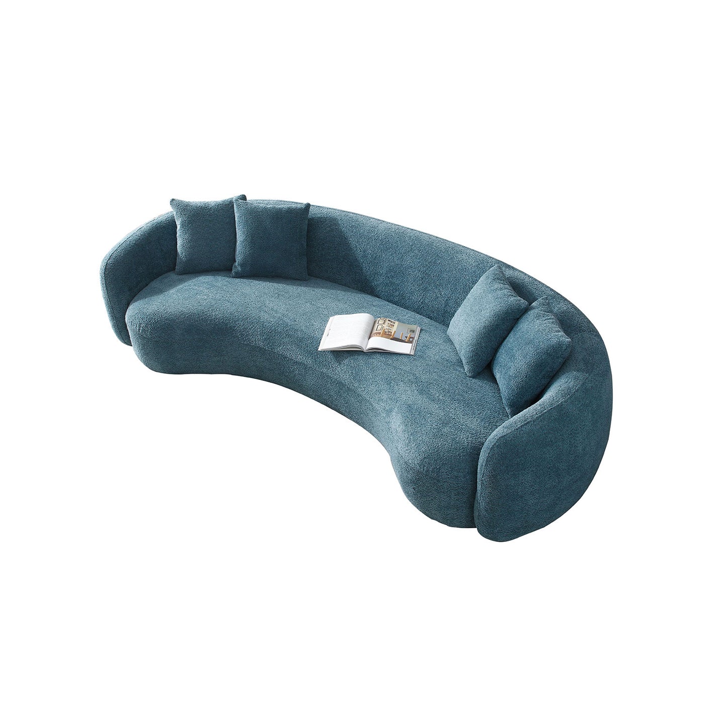 Curved teal fabric sofa with plush cushions and an open book