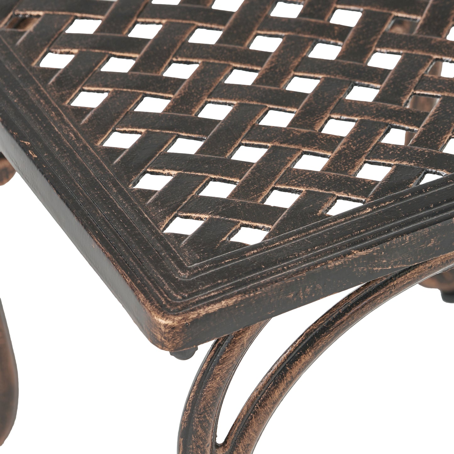 Close up of bronze lattice weave patio table top with ornate scrolling legs