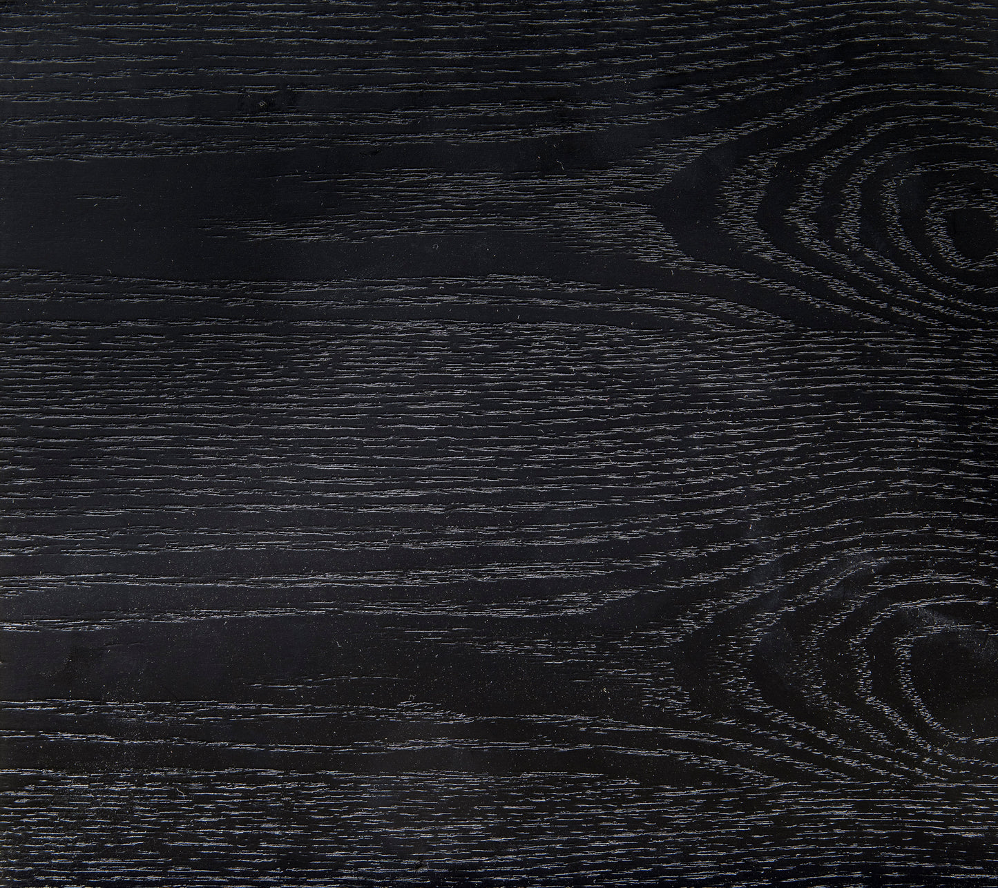 Textured black wood grain surface for furniture showcasing subtle linear patterns