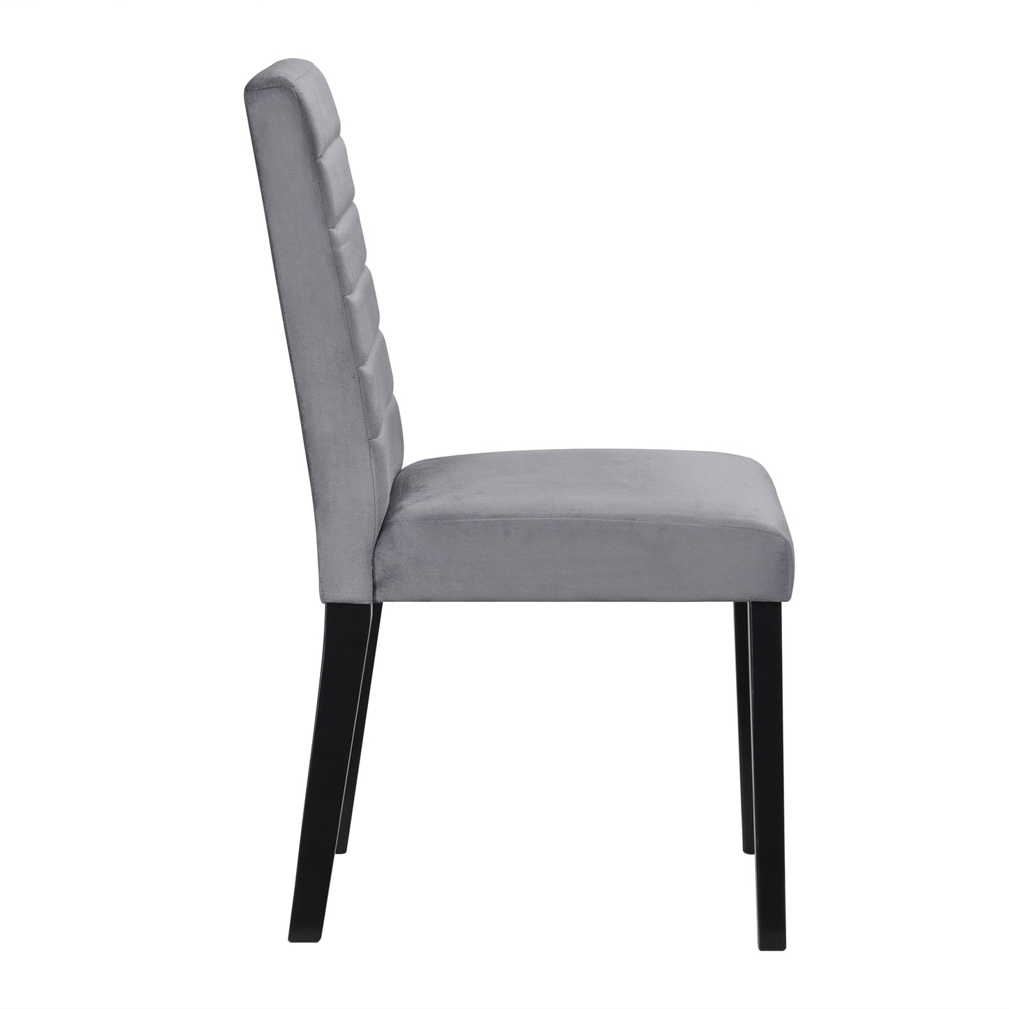 Side view of a plush grey velvet dining chair with black tapered legs and channel tufted back