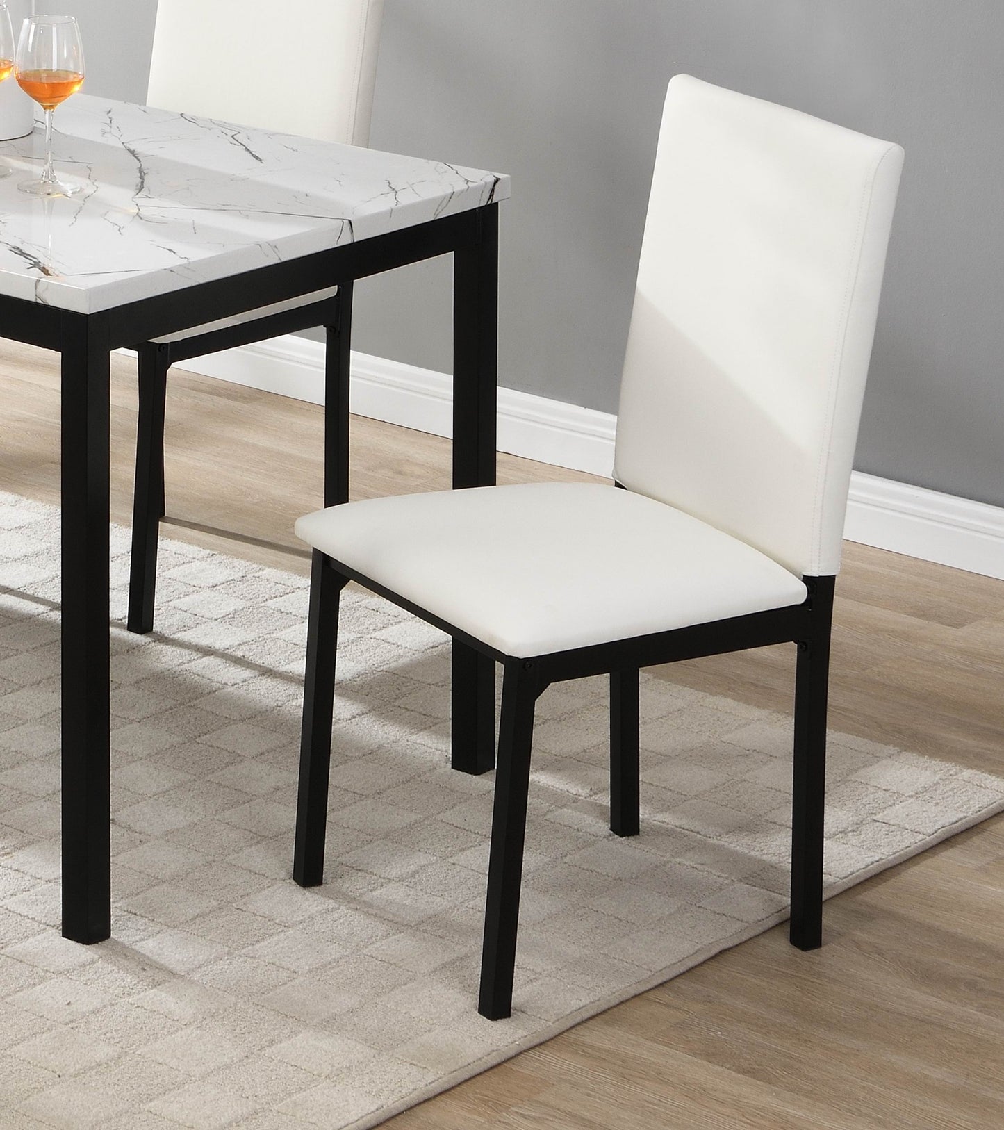 White upholstered dining chair with black metal legs perfect for modern kitchens