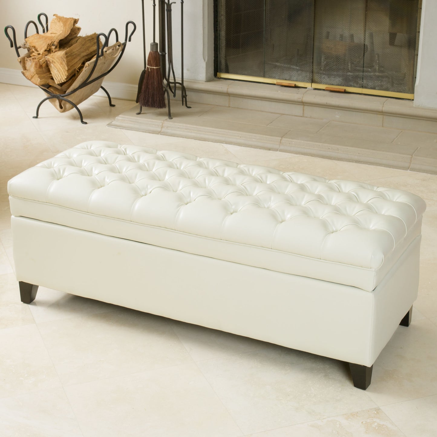 White tufted faux leather storage ottoman with dark wood legs