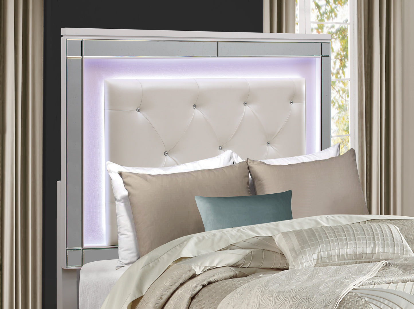 White tufted headboard with mirrored accents and LED lighting for a modern bedroom