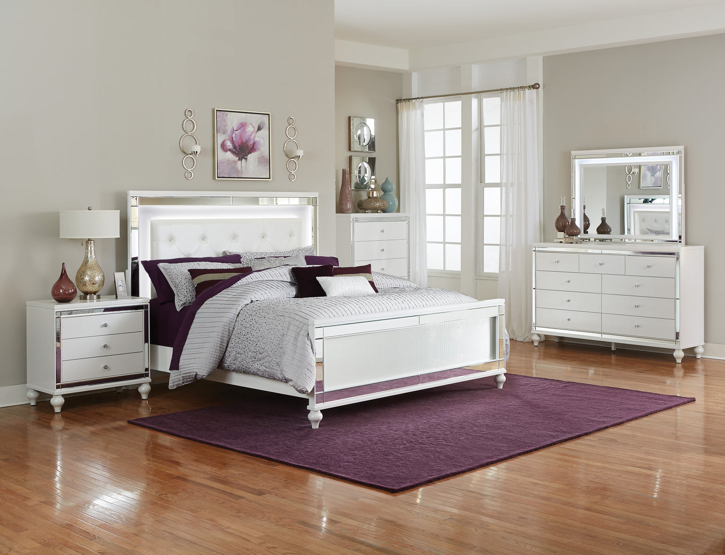 White upholstered queen bed with crystal tufting and LED headboard featuring mirrored accents