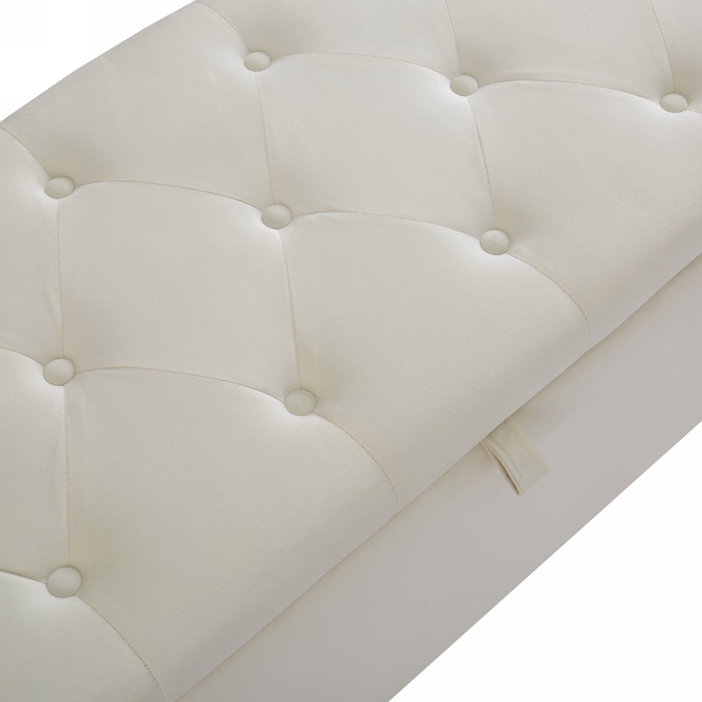 Cream upholstered tufted storage ottoman detail