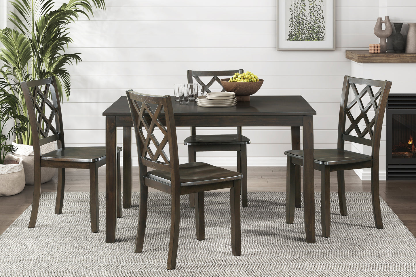 Dark wood dining table set with diamondpatterned chairs