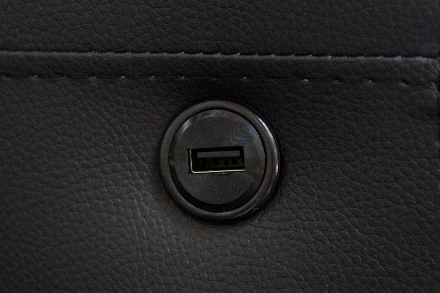 Black faux leather recliner with builtin USB charging port for modern convenience