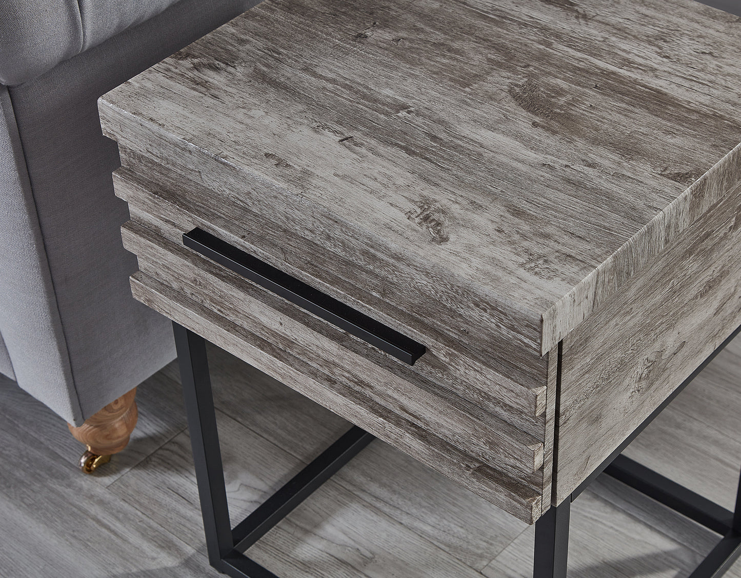 weathered wood side table with black metal legs and drawer