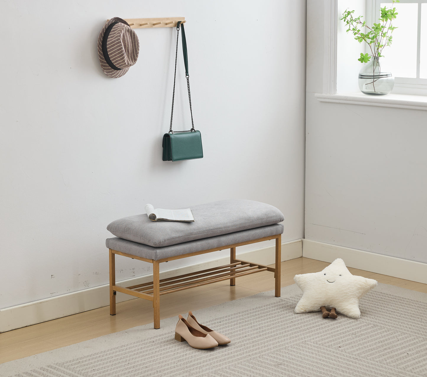 Grey fabric entryway bench with wooden frame and shoe rack