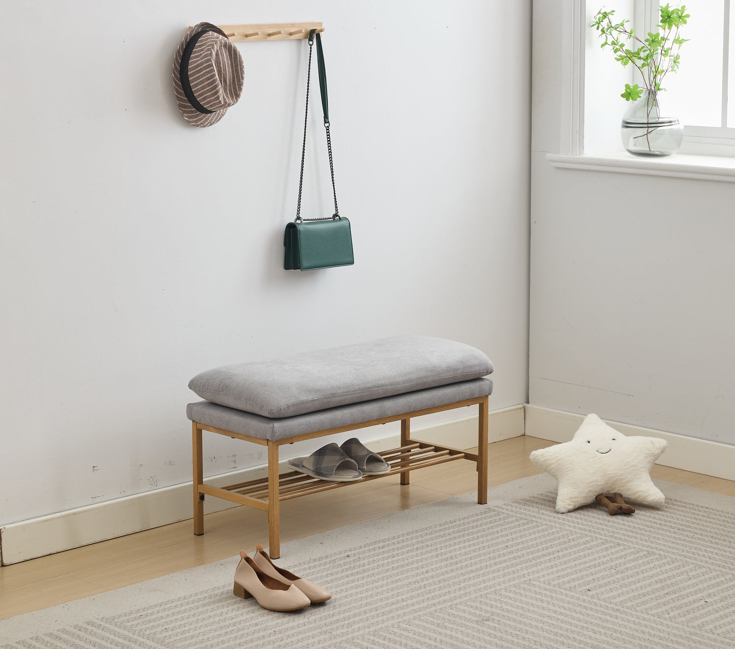 Grey fabric entryway bench with wooden frame and shoe rack