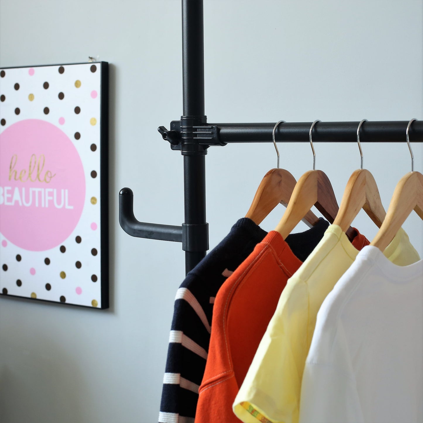 Navy and white striped longsleeve shirt on wooden hanger