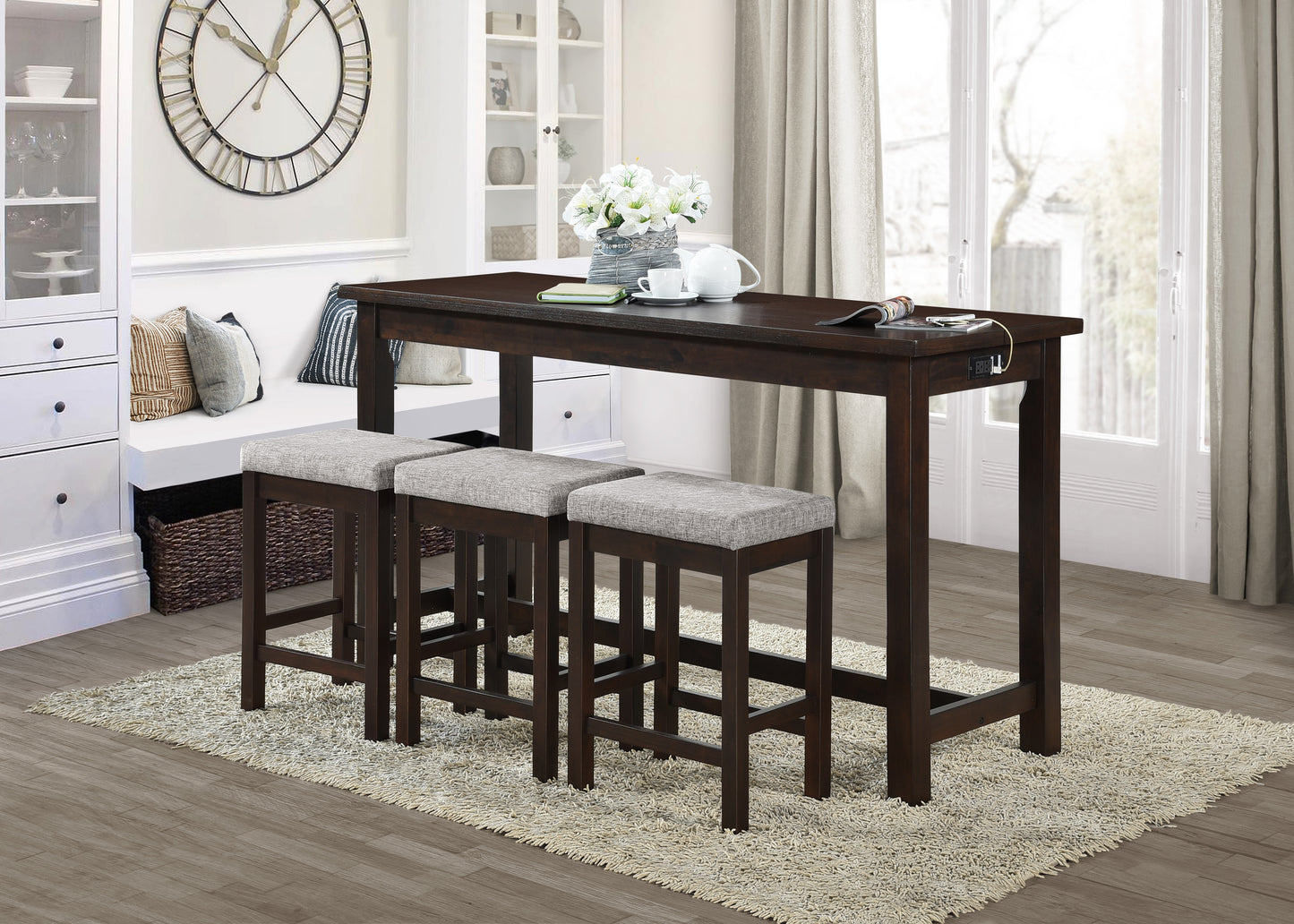 Dark wood counter height dining table with builtin charging station and three grey upholstered stools