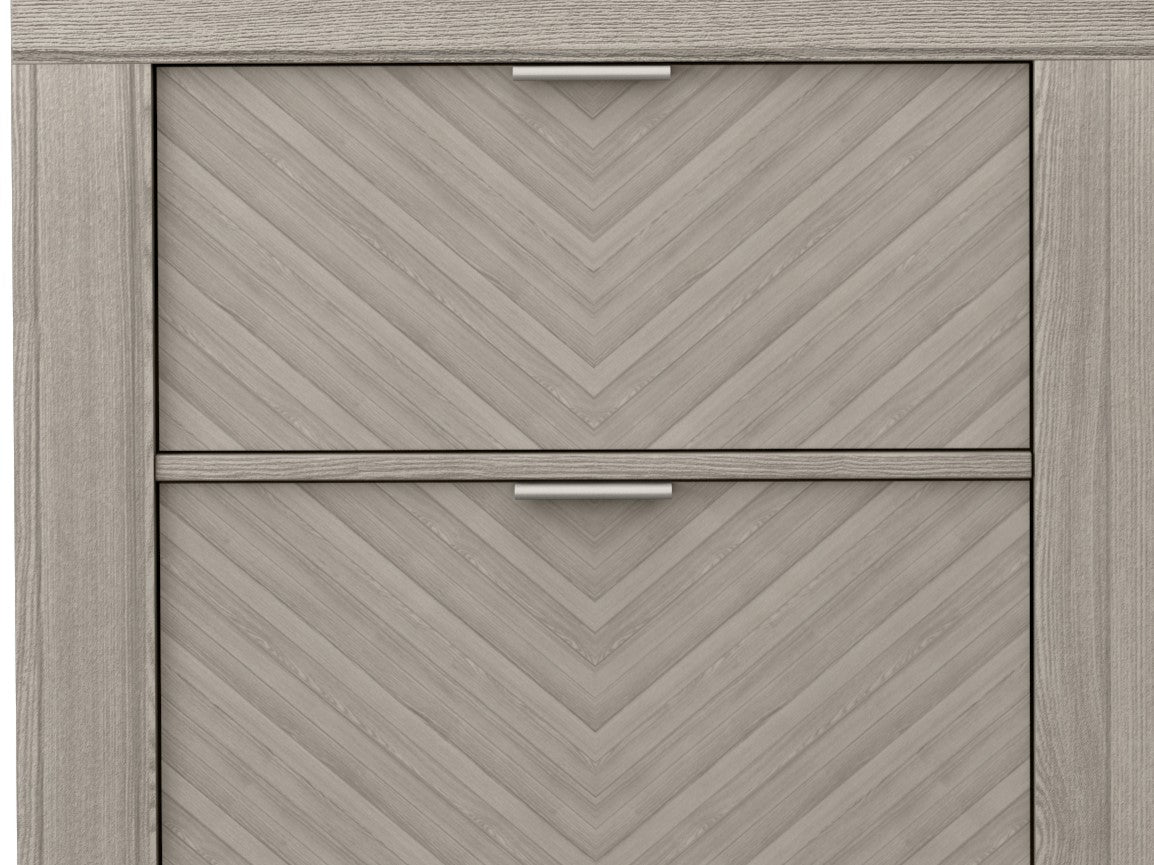 Twodrawer grey wood dresser with a chevron patterned front and silver handles
