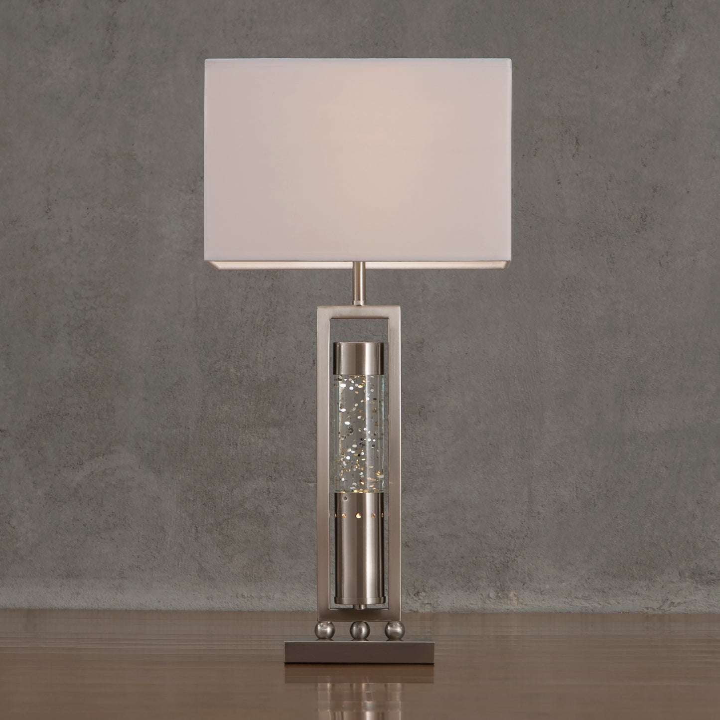 Modern brushed nickel table lamp with crystalfilled cylinder and white rectangular shade