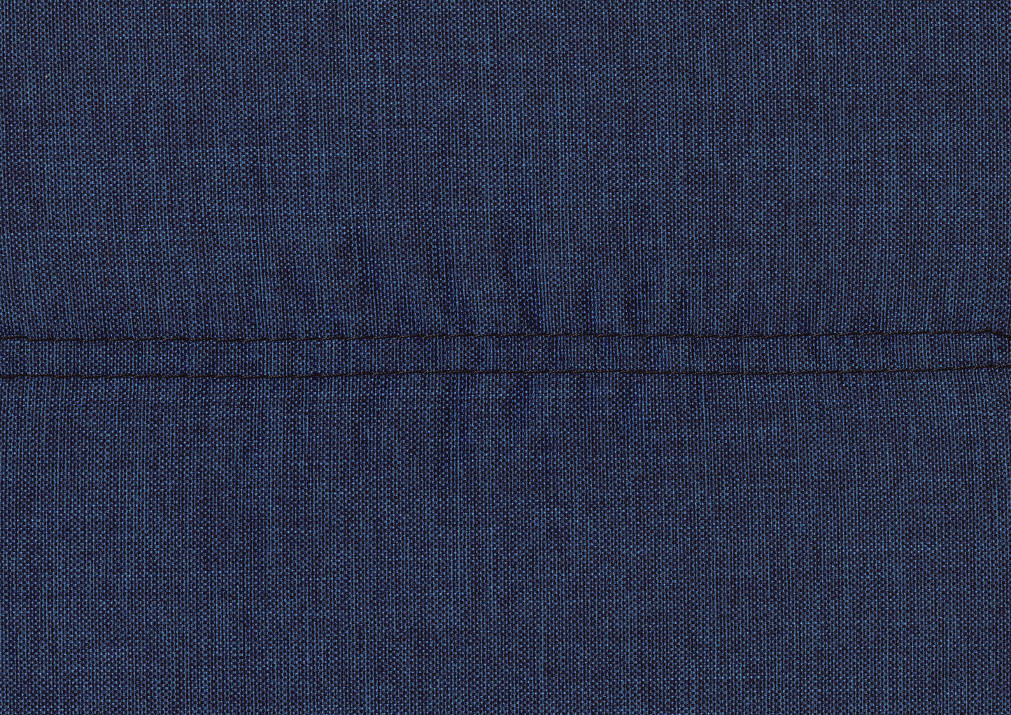 Closeup of a dark blue woven fabric texture with a contrasting black stitch detail